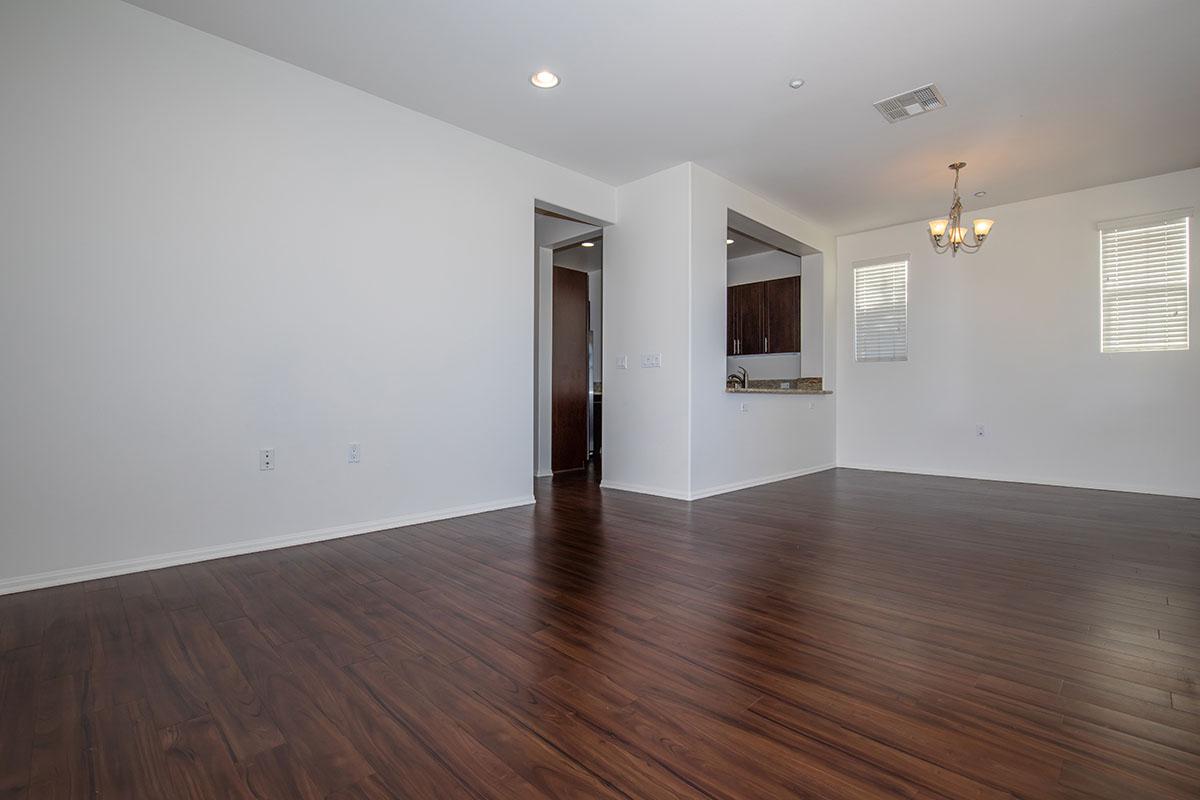 a large empty room with a wood floor