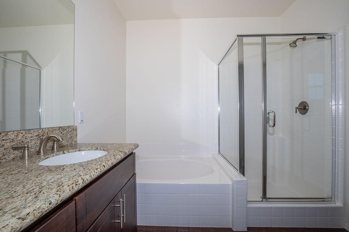 a room with a sink and a shower