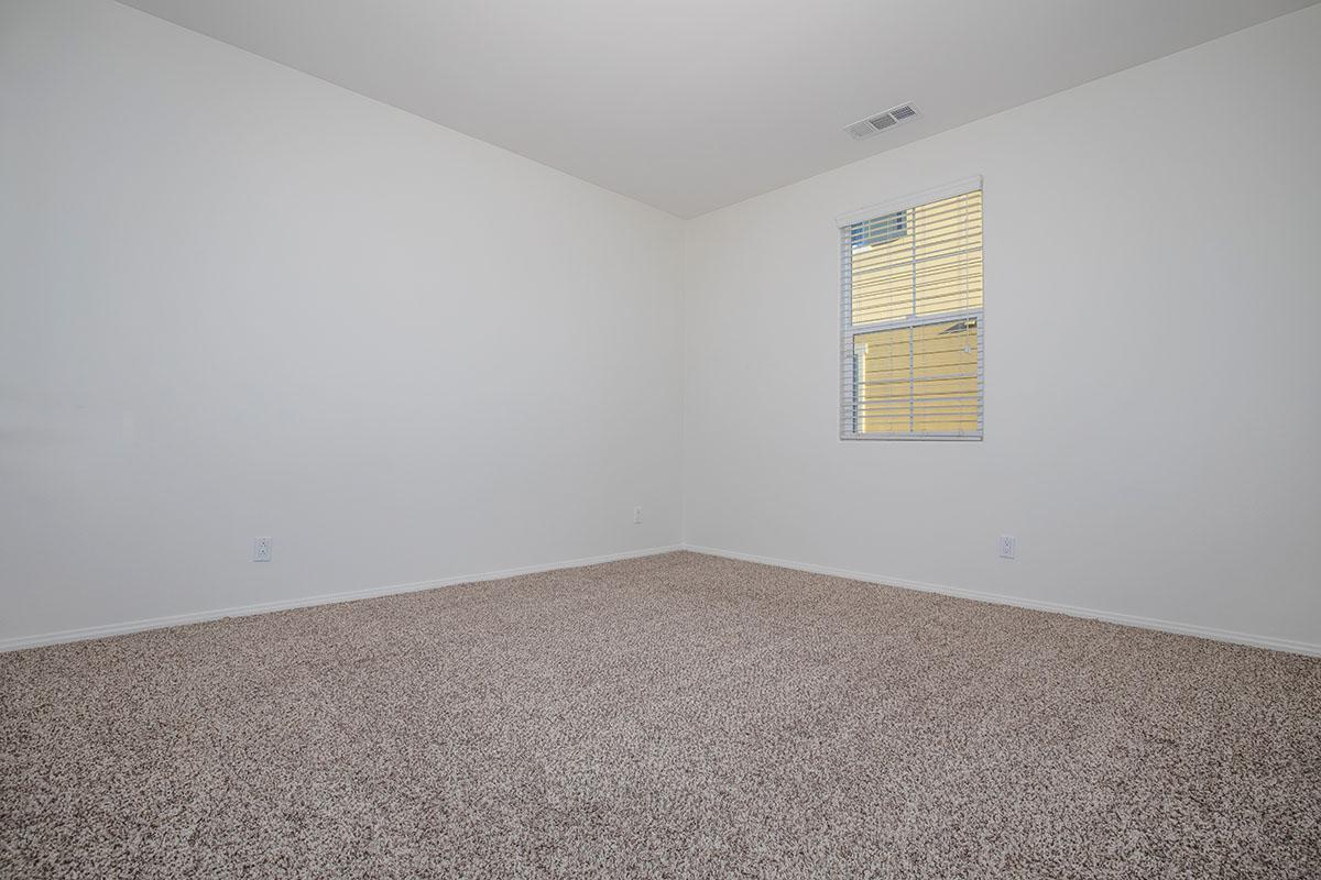 a bedroom with a bed in a room