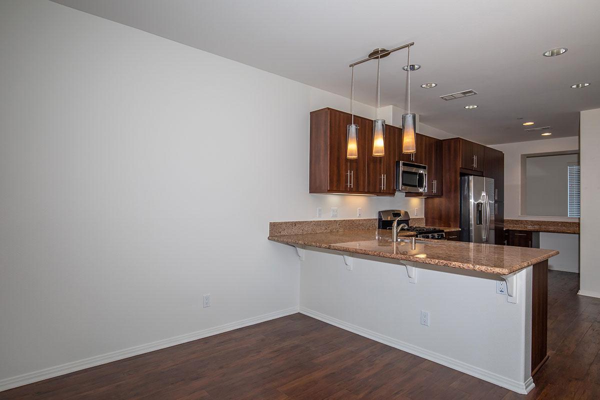 a kitchen with a sink and a mirror