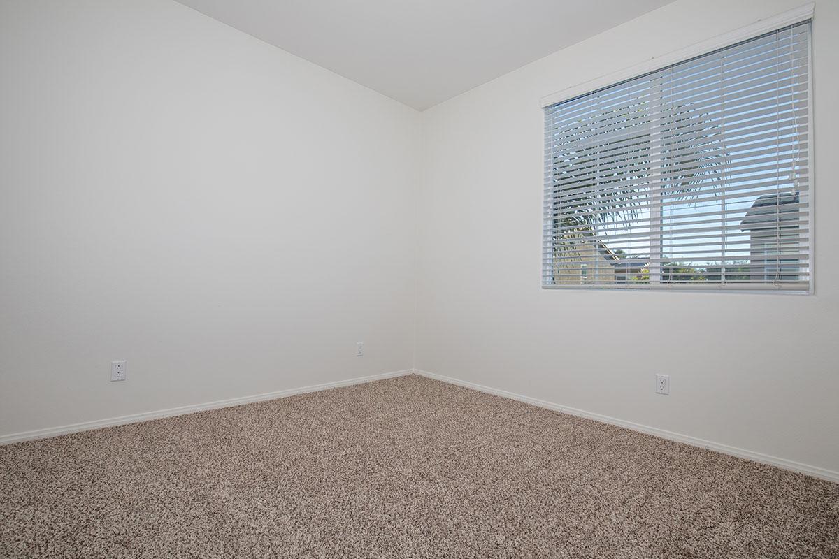 a bedroom with a large window