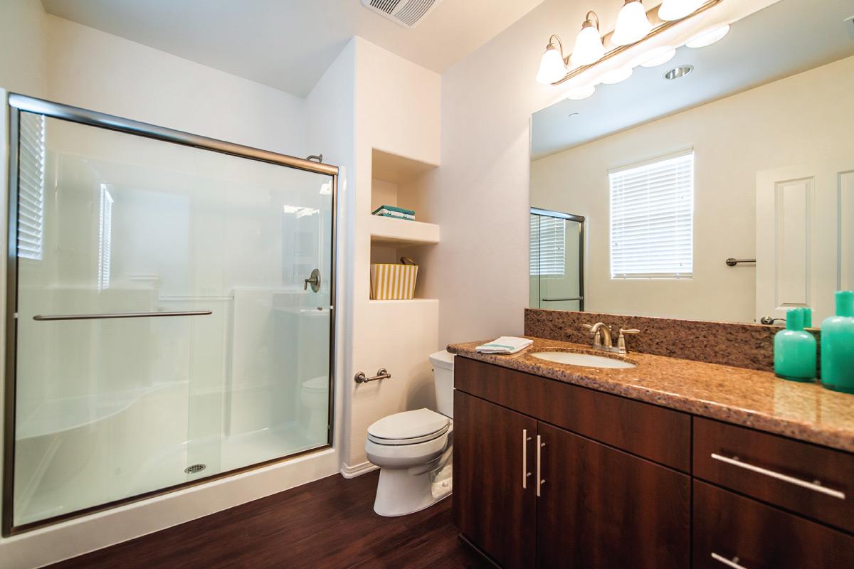 a room with a sink and a mirror