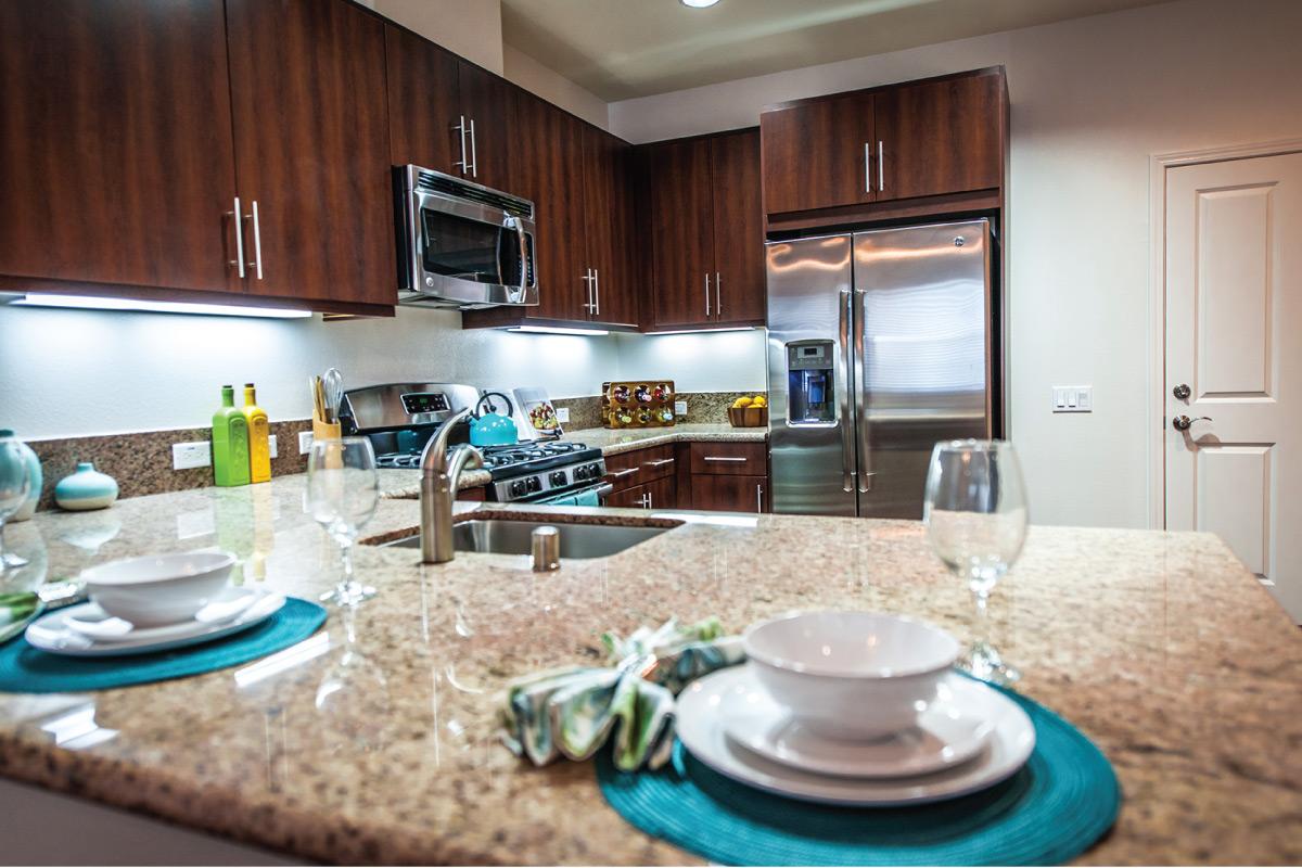 an island in the middle of a kitchen counter
