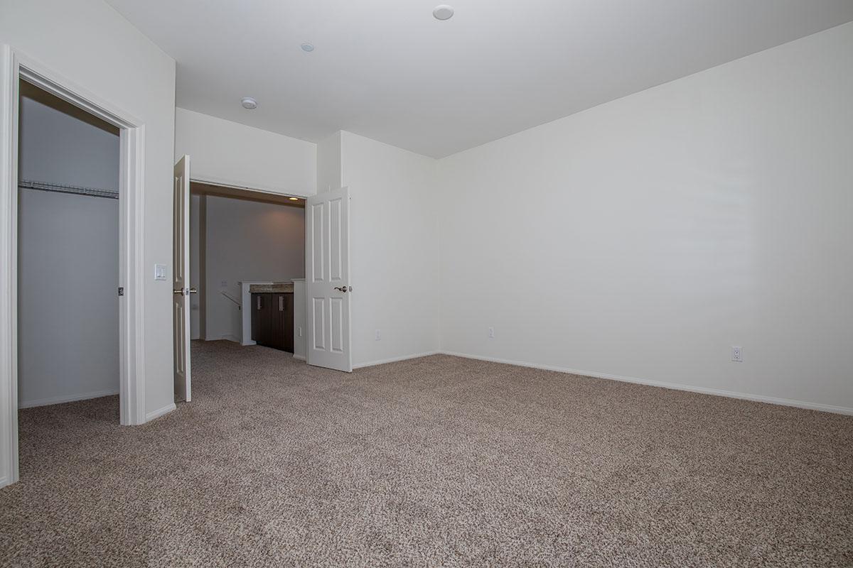 a bedroom with a bed in a room