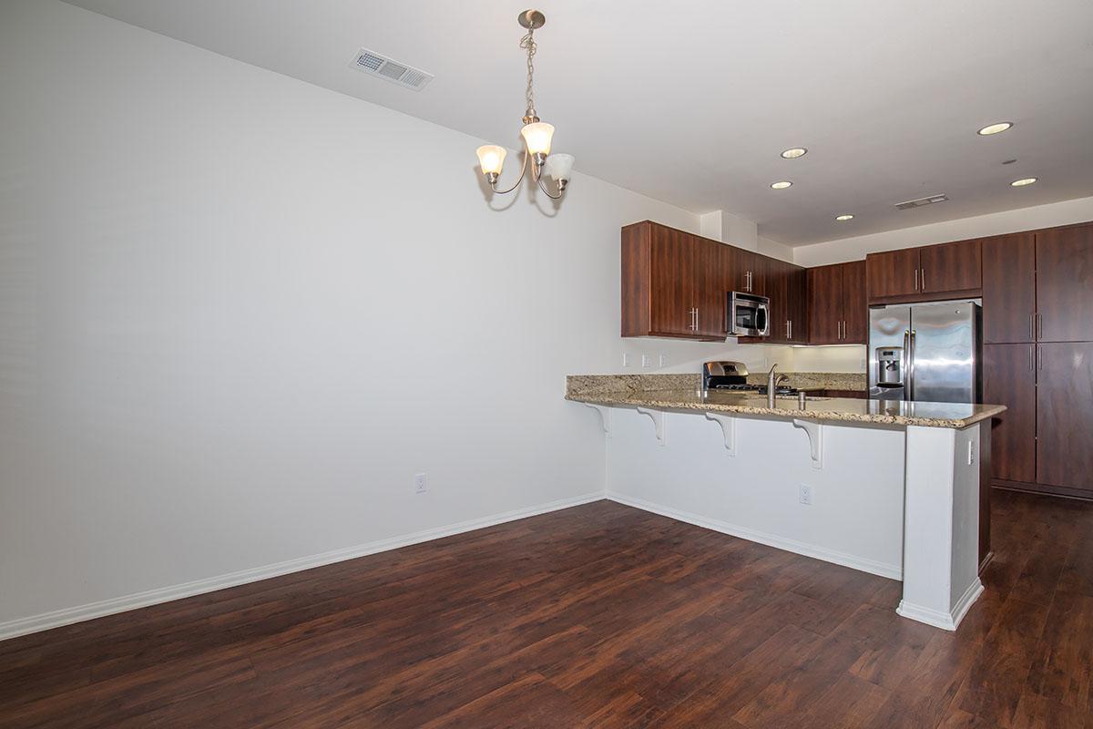a kitchen with a wood floor