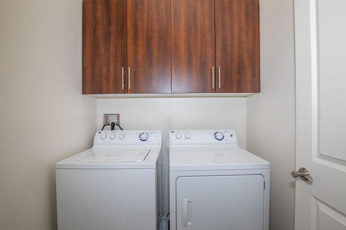 a white refrigerator freezer sitting next to a sink