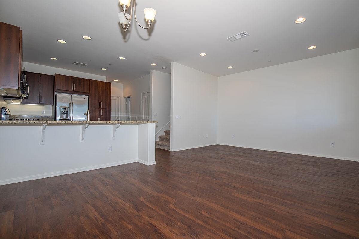 a kitchen with a wood floor