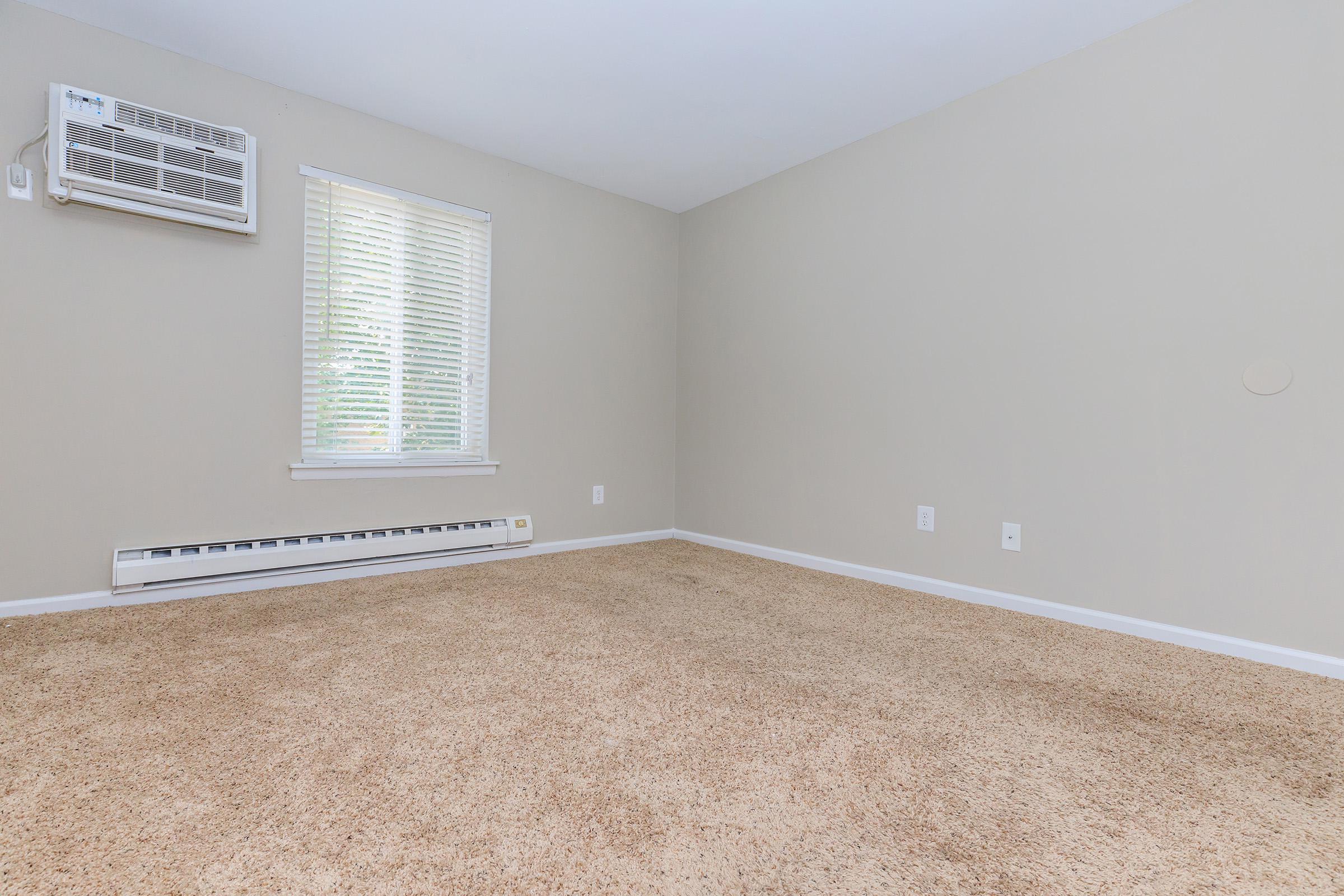 a bedroom with a large window