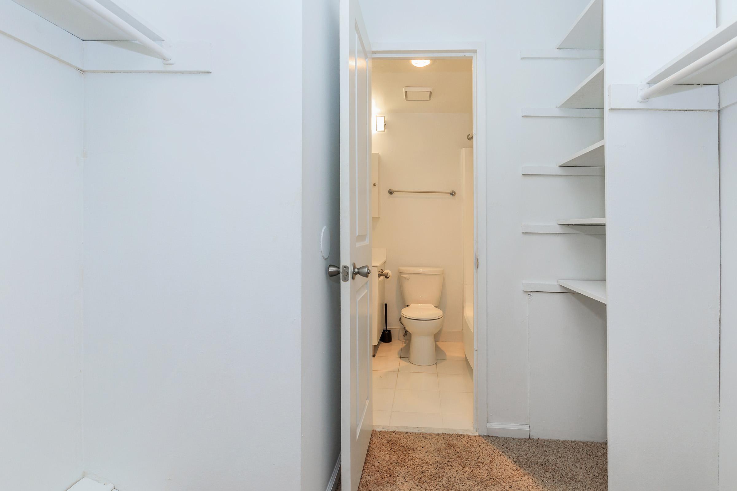 a white sink sitting next to a door