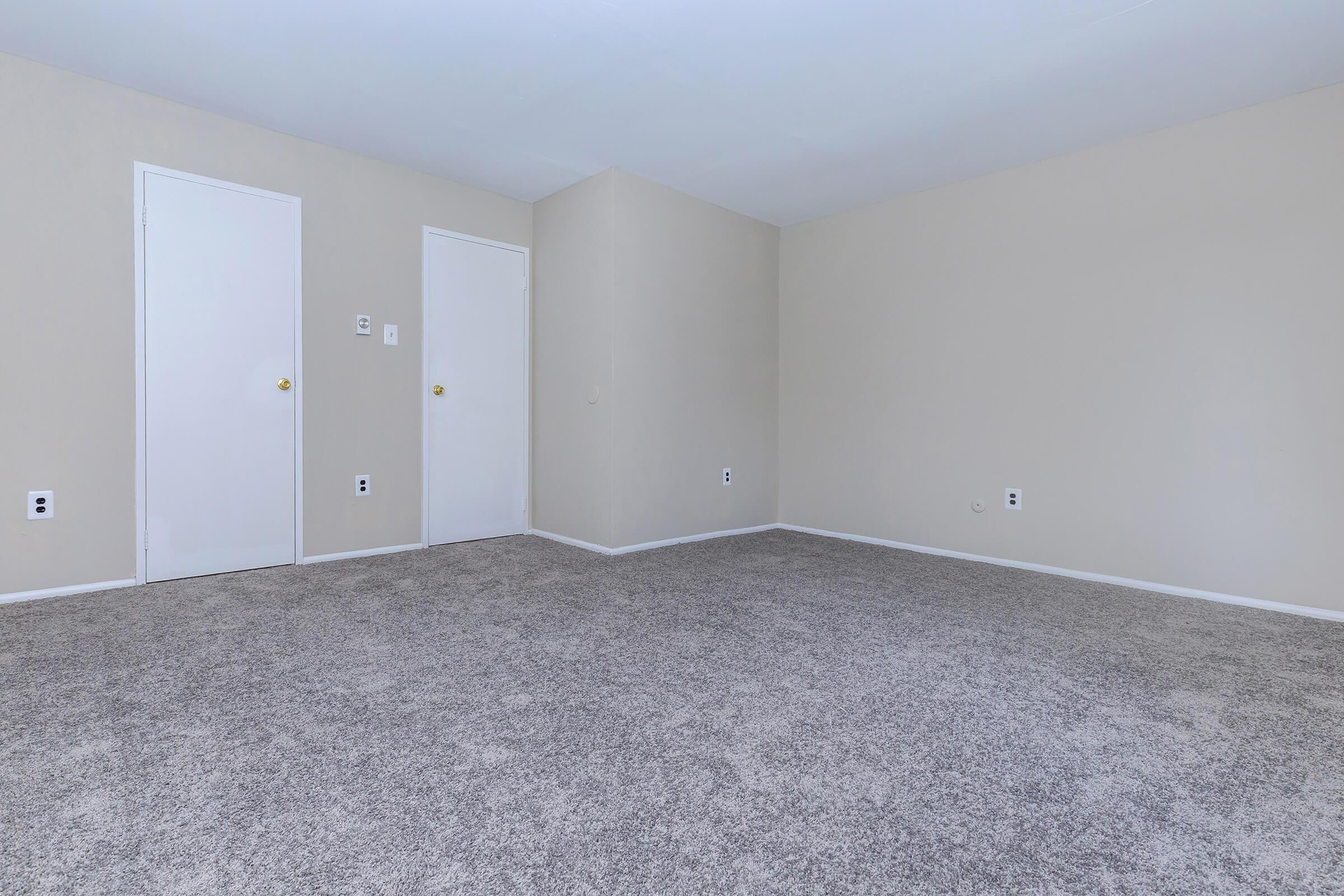 a bedroom with a bed in a room