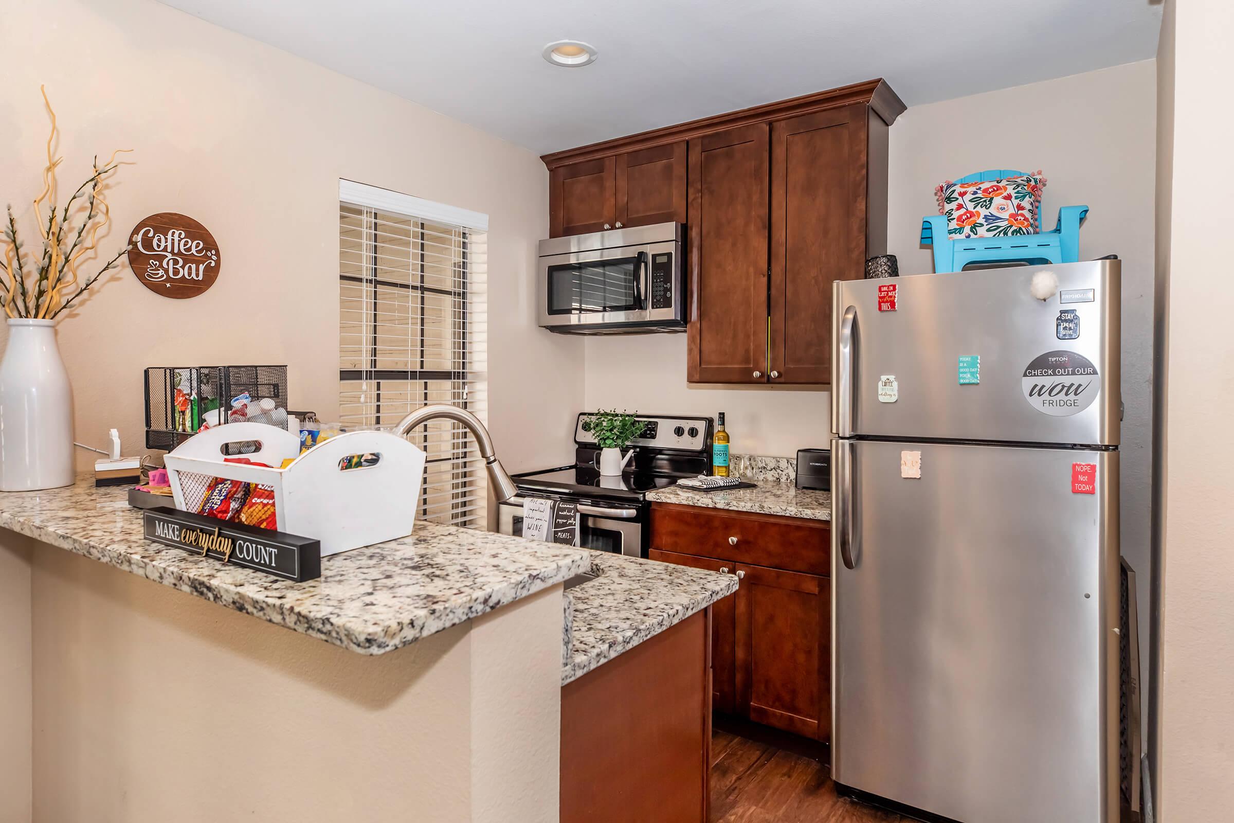 a stainless steel refrigerator in a kitchen