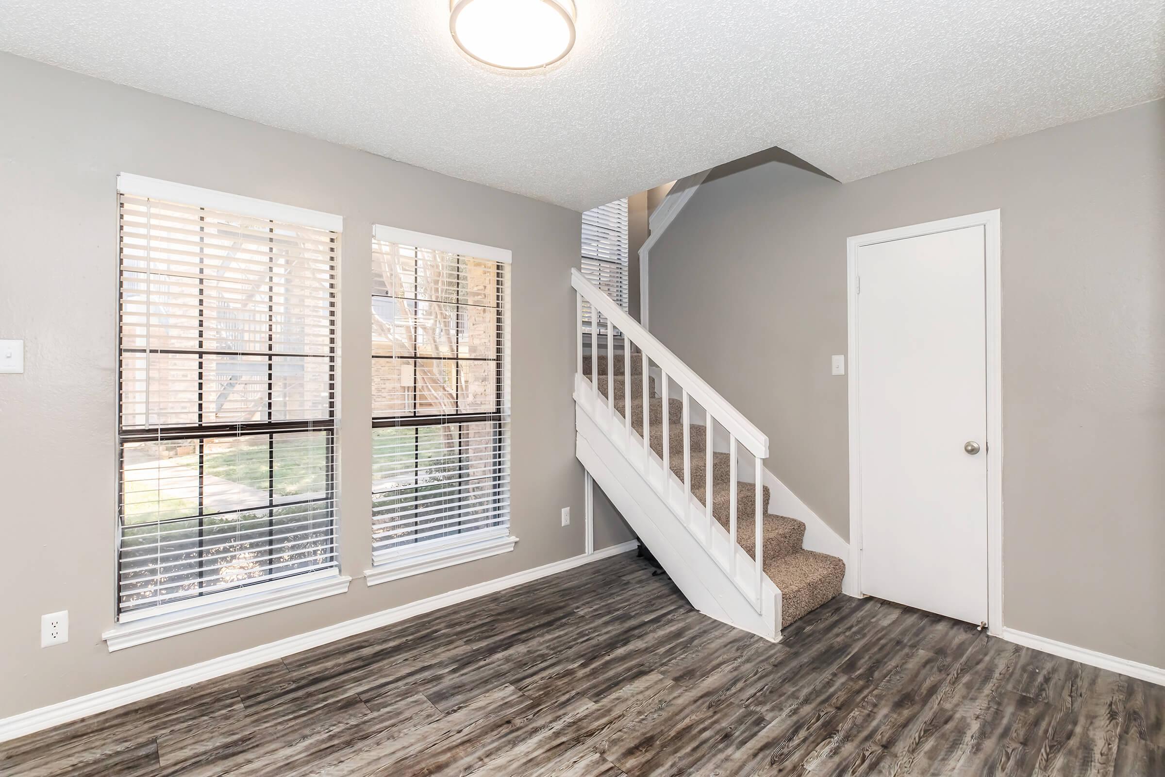 a room filled with furniture and a large window