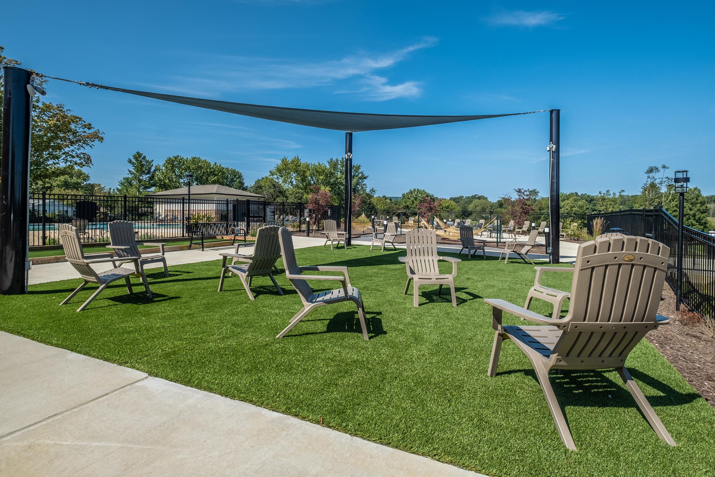 a couple of lawn chairs sitting on top of a picnic table