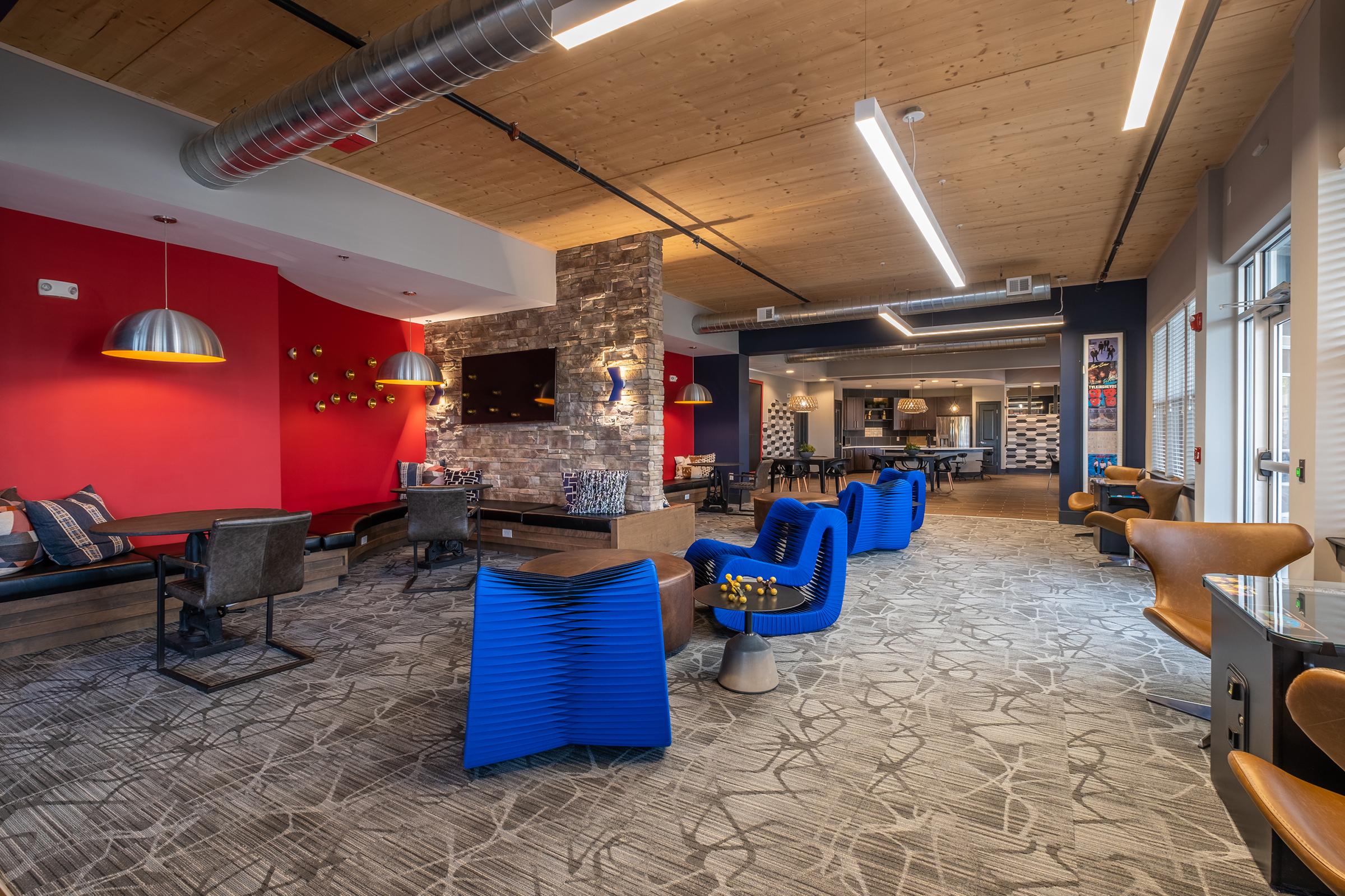 a room filled with furniture and a blue chair