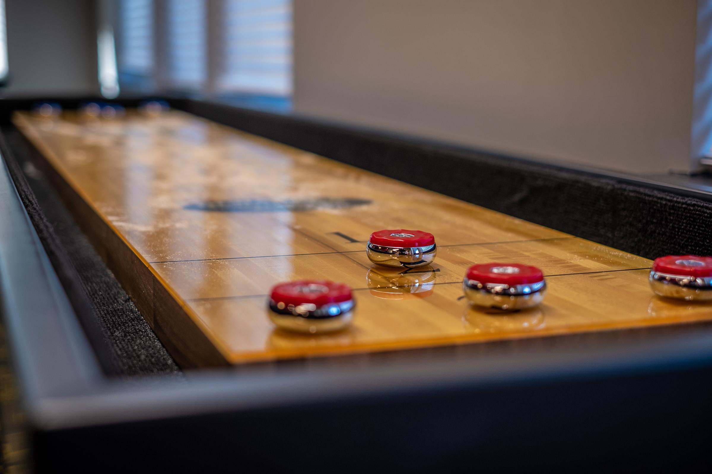 a close up of a laptop computer sitting on top of a wooden table