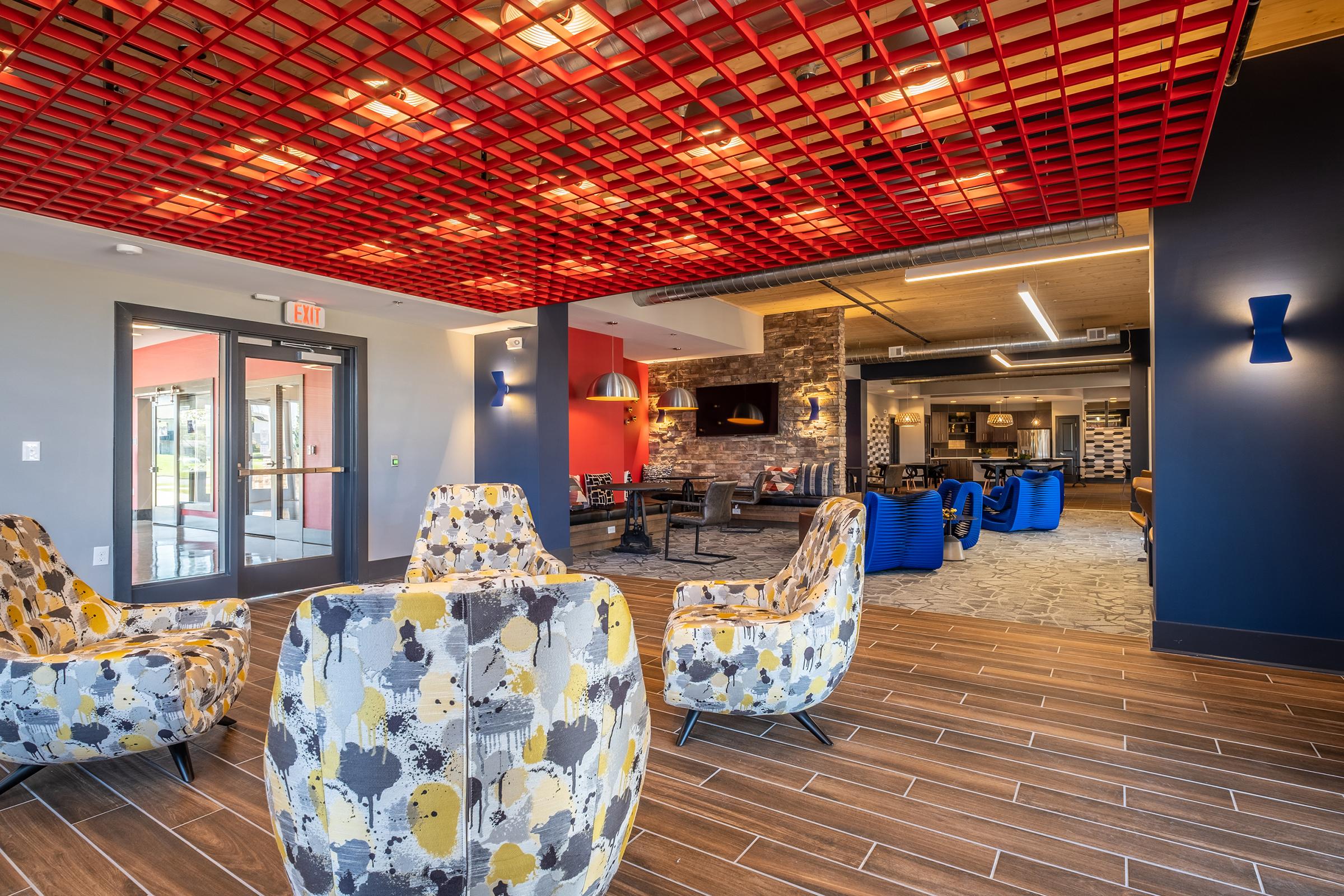 a living room filled with furniture and a rug