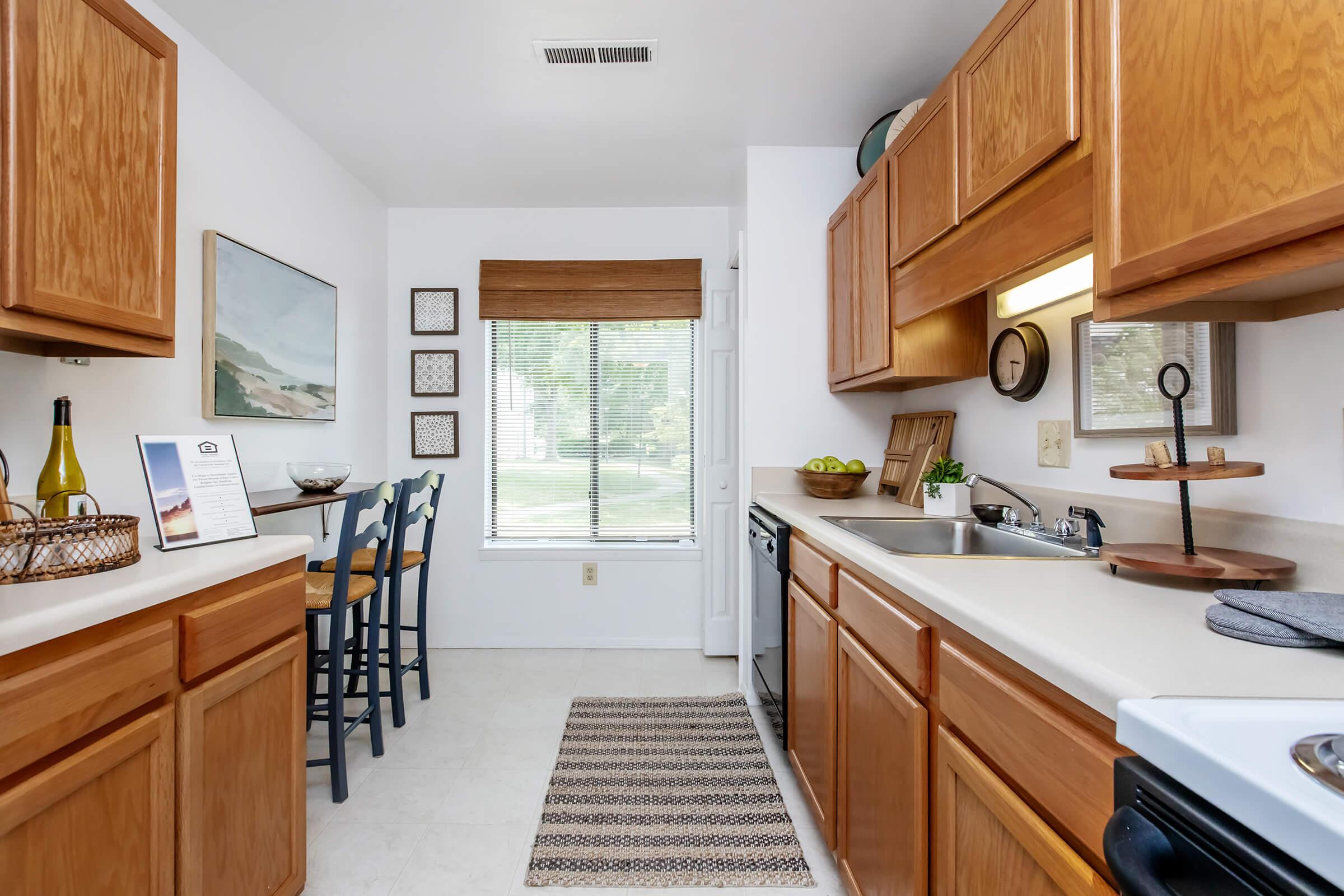 a kitchen with a stove top oven sitting inside of a wooden table