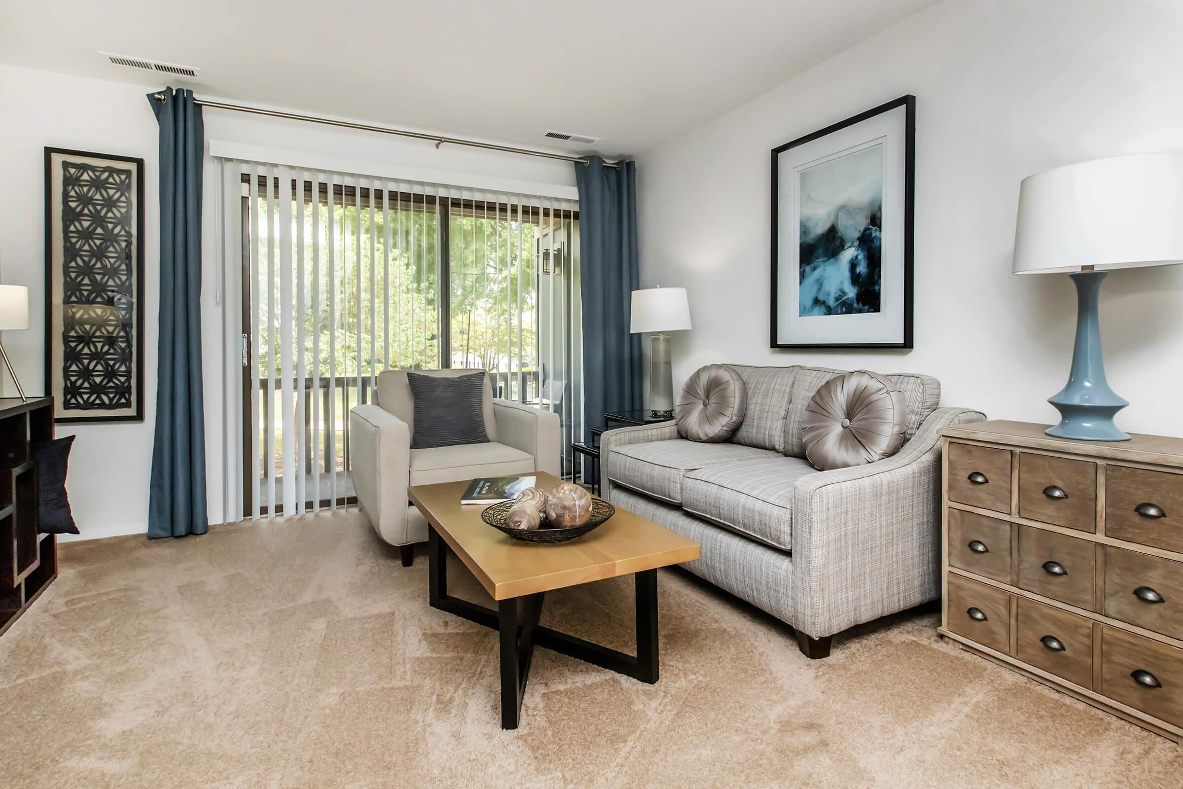 a living room filled with furniture and a flat screen tv