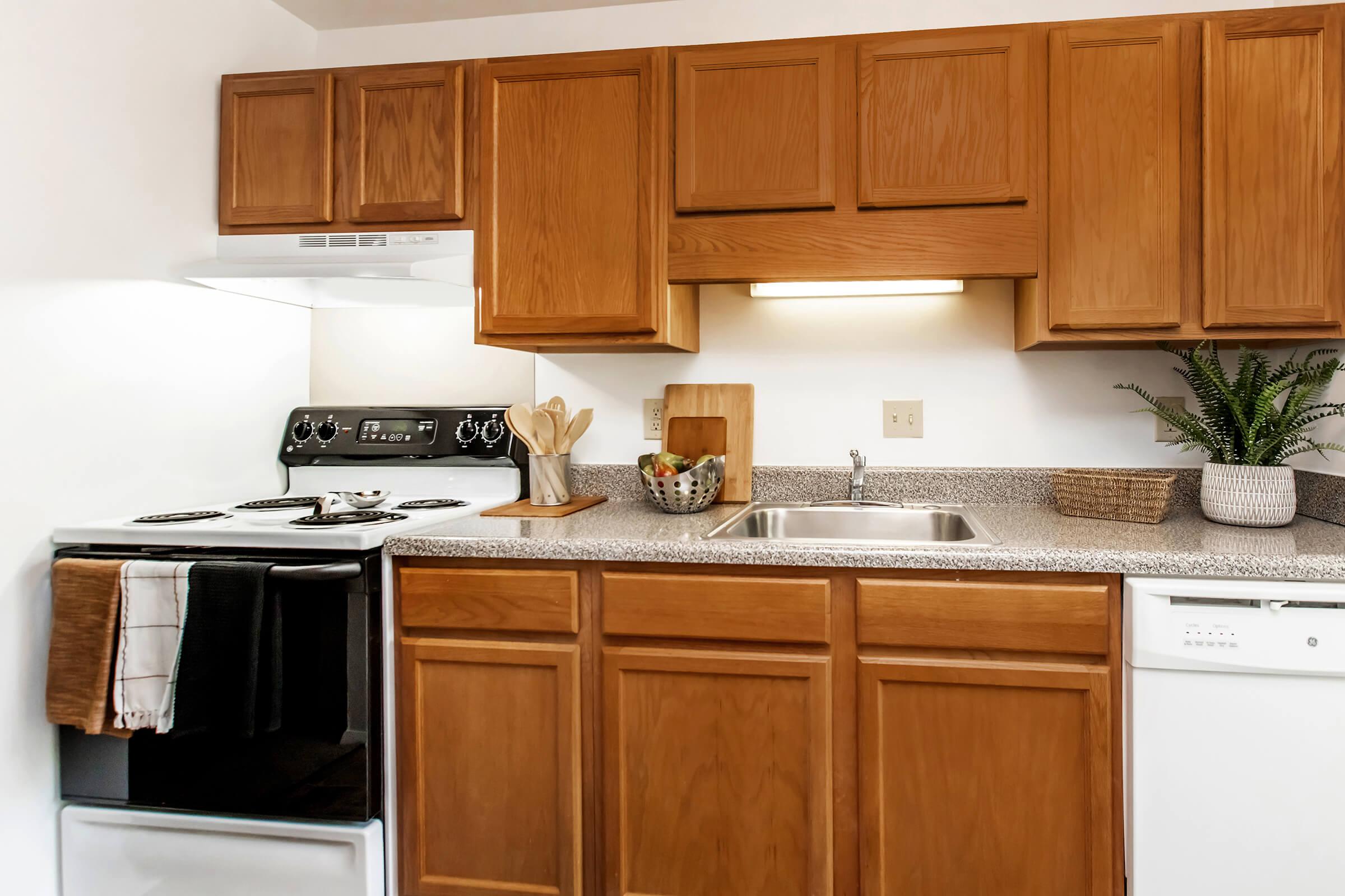 a kitchen with a refrigerator stove and microwave