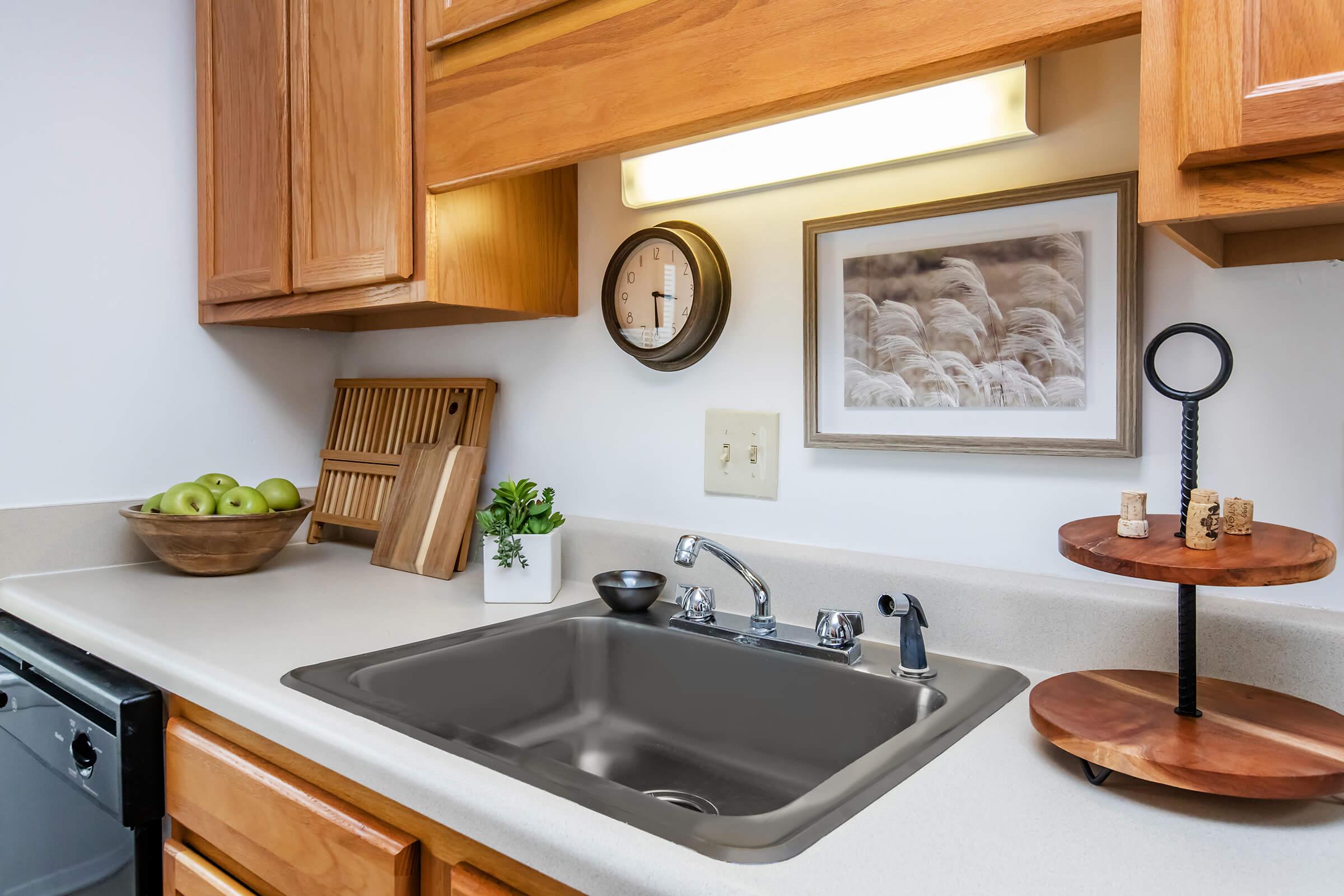 a kitchen with a stove and a sink