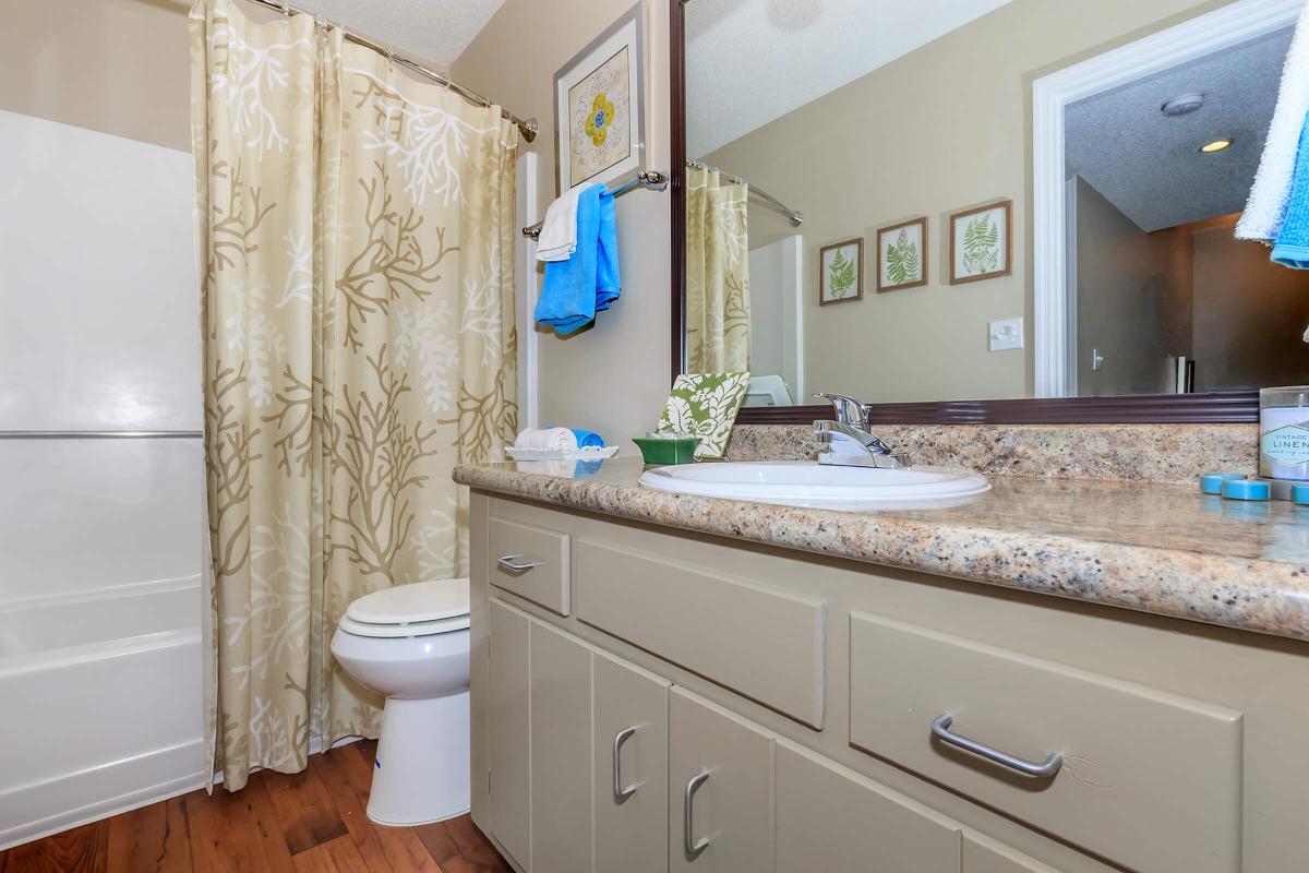 a kitchen with a sink and a mirror