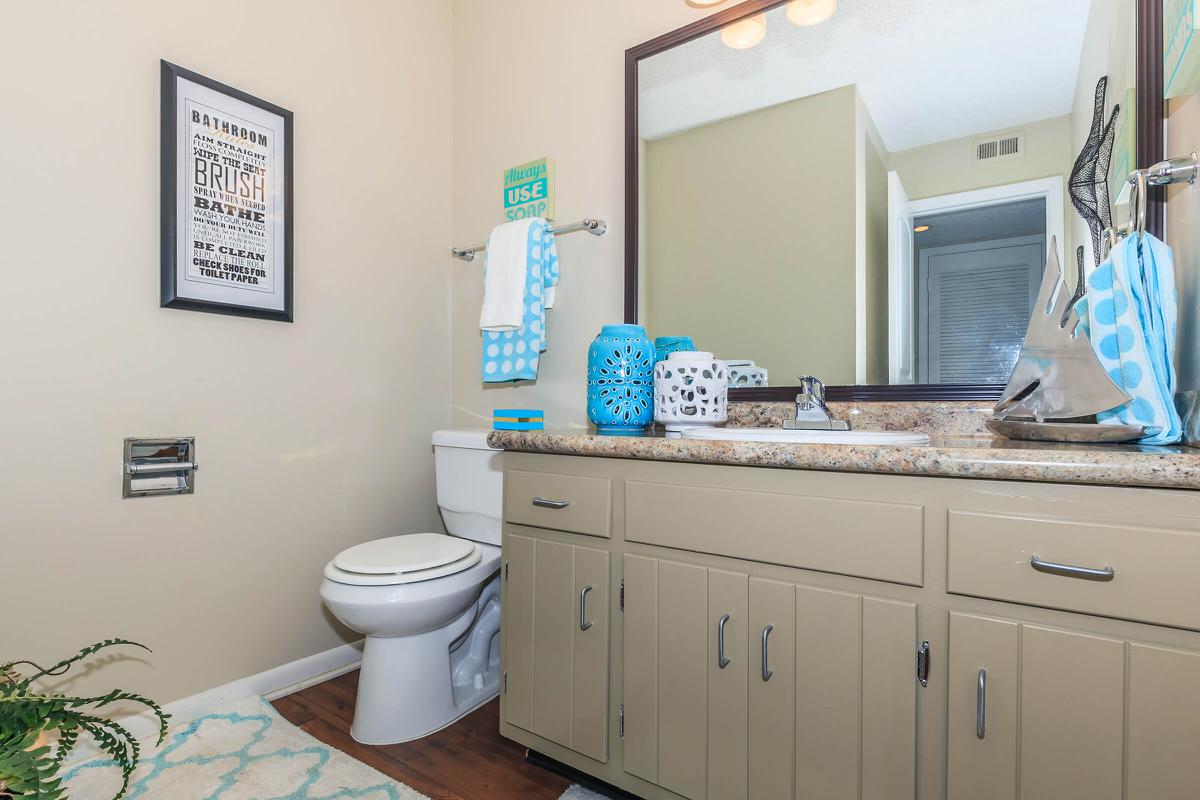 a room with a sink and a mirror