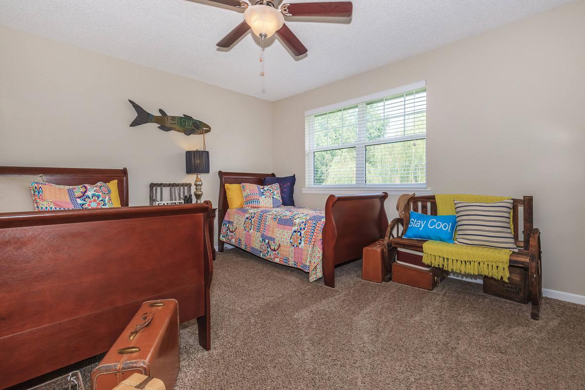 a living room filled with furniture and a window