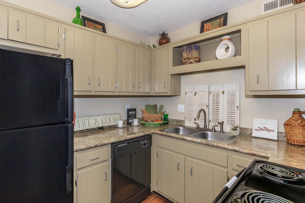 a kitchen with a stove and a refrigerator