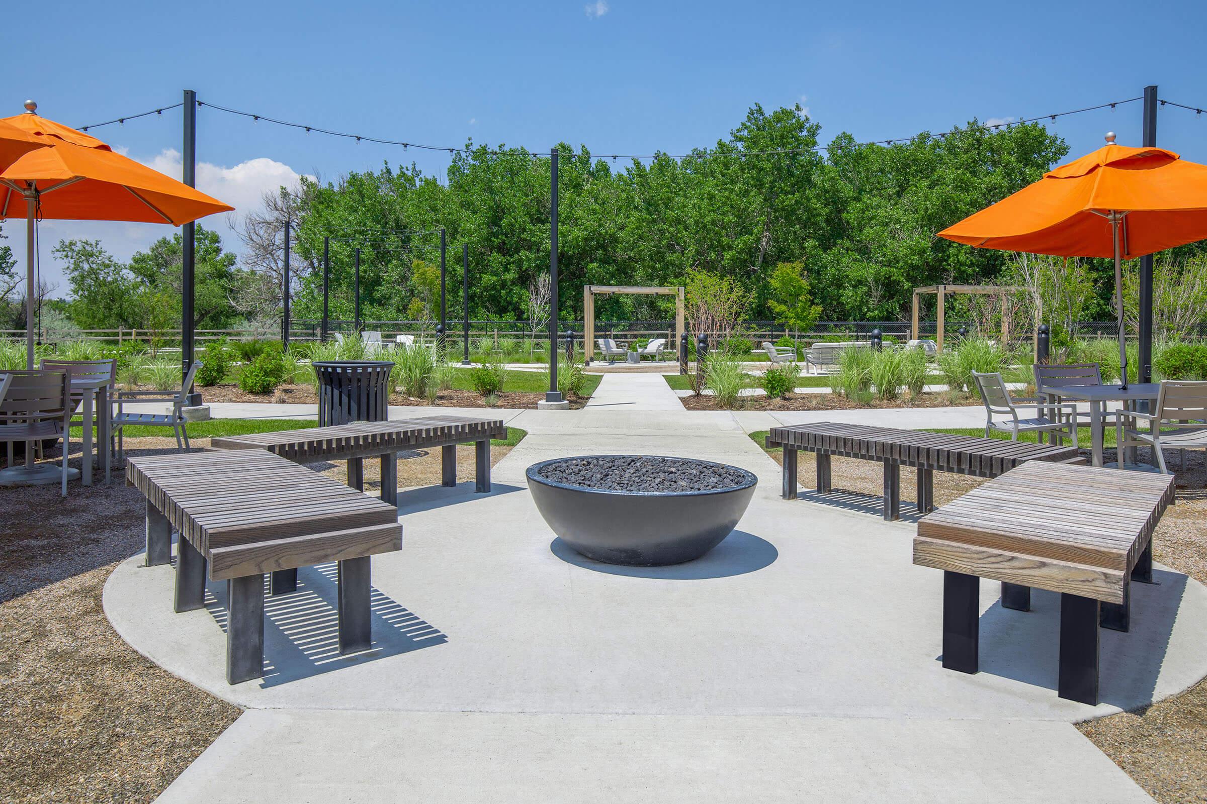 a group of lawn chairs sitting on top of a picnic table