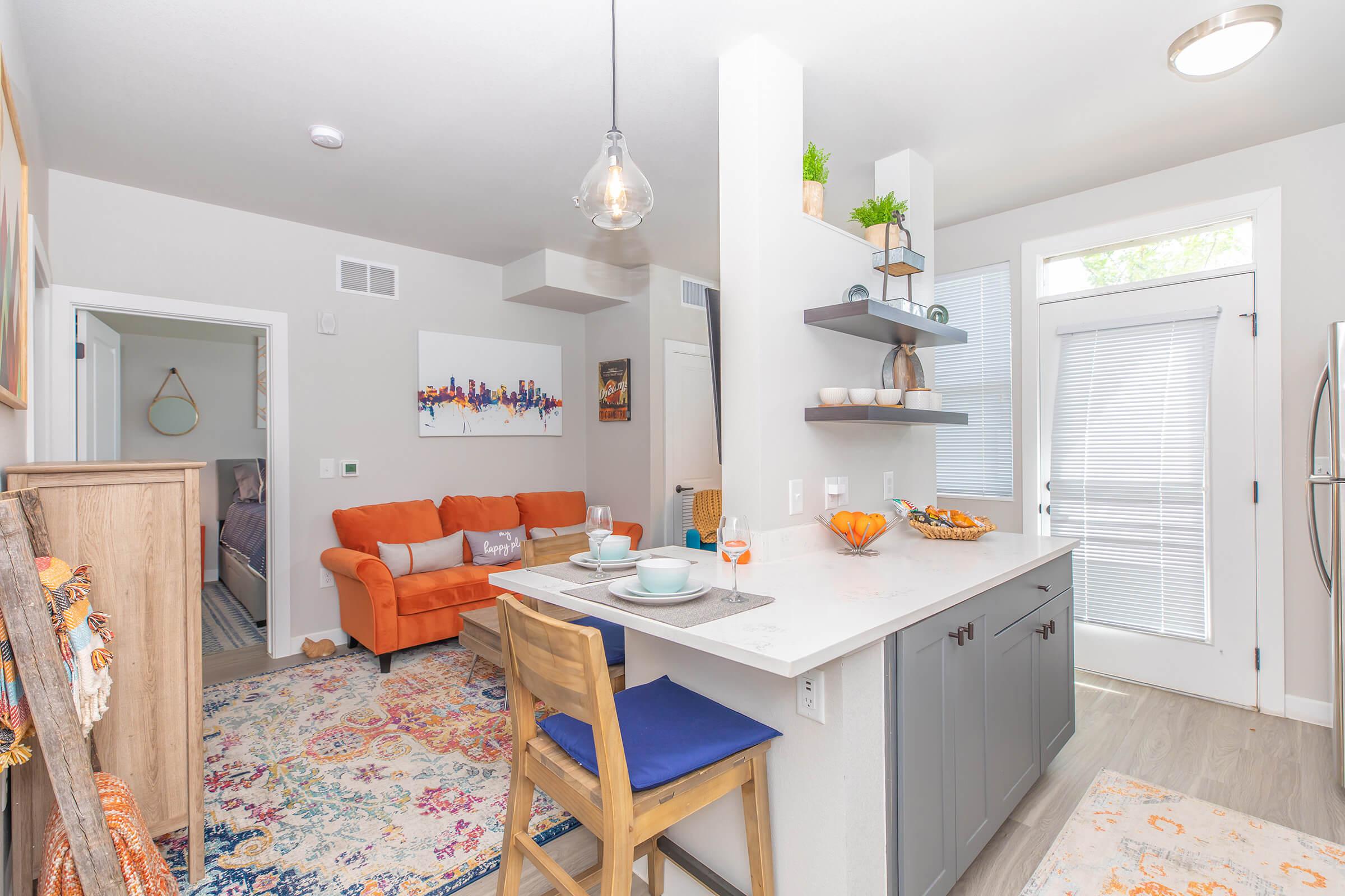 a kitchen with a table in a room