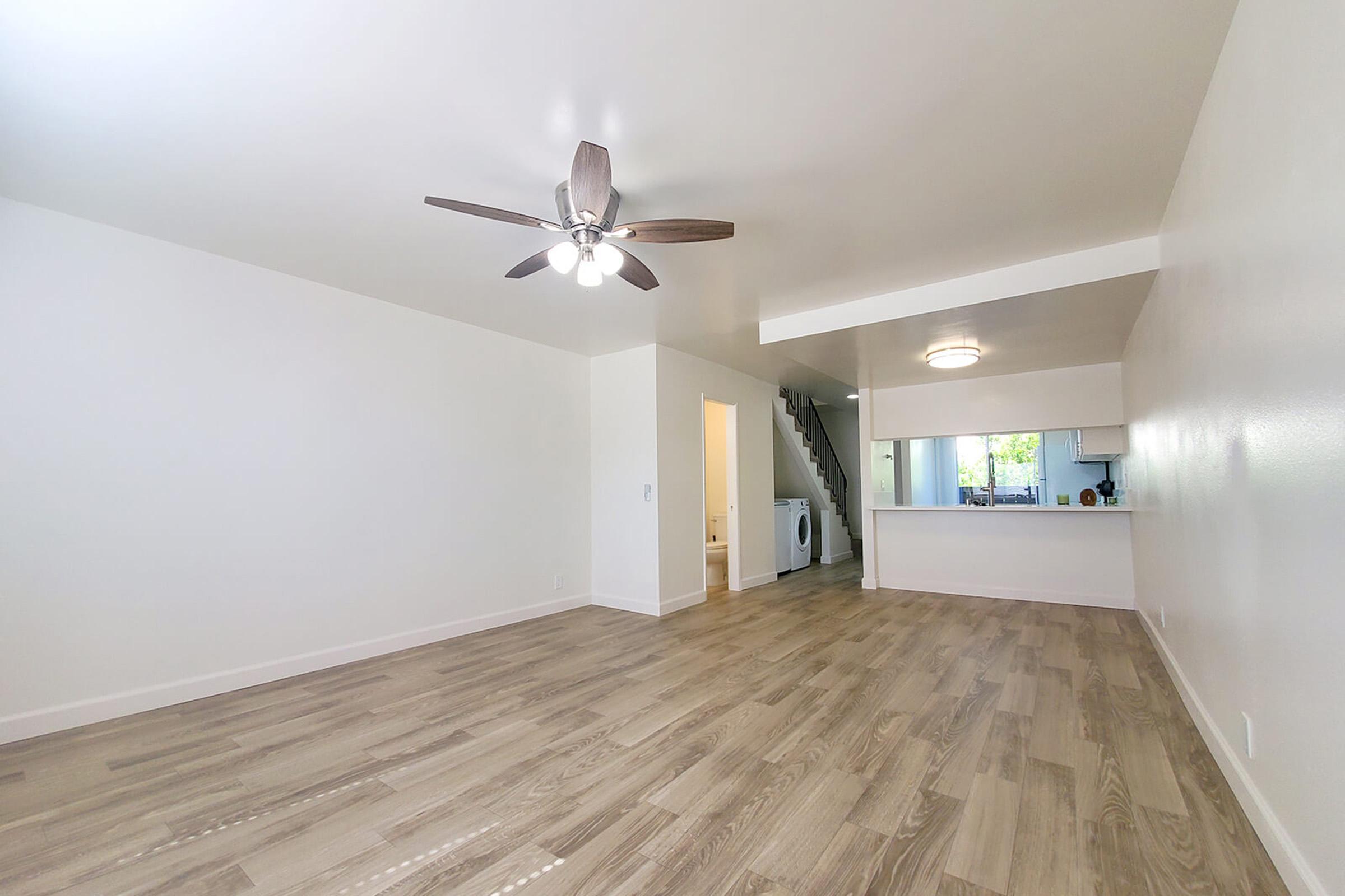 a bedroom with a wooden floor