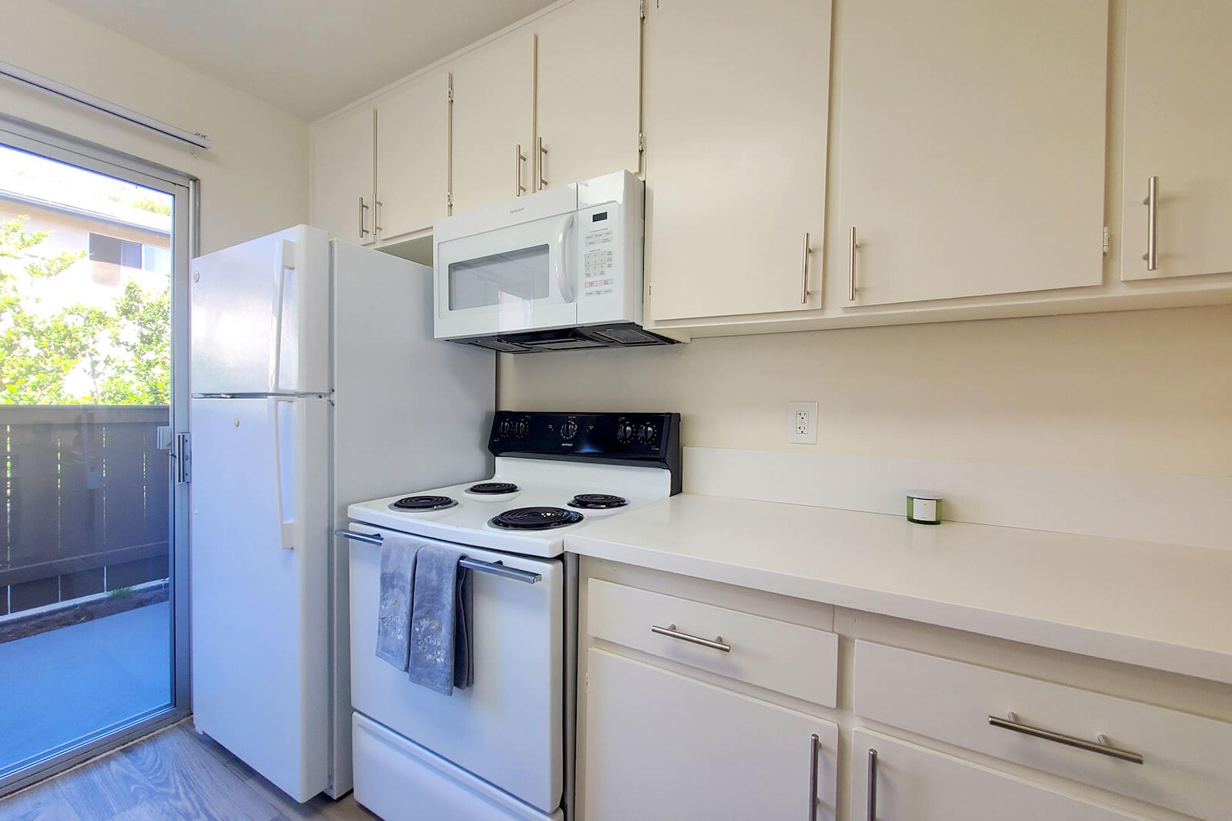 a kitchen with a sink and a microwave