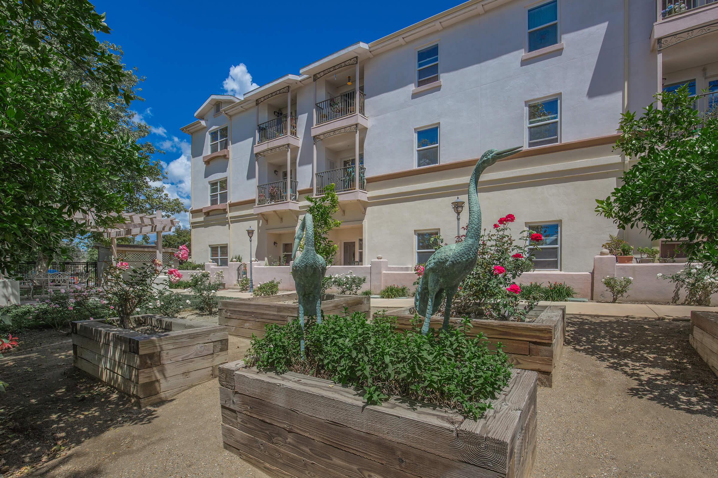 a large stone statue in front of a building