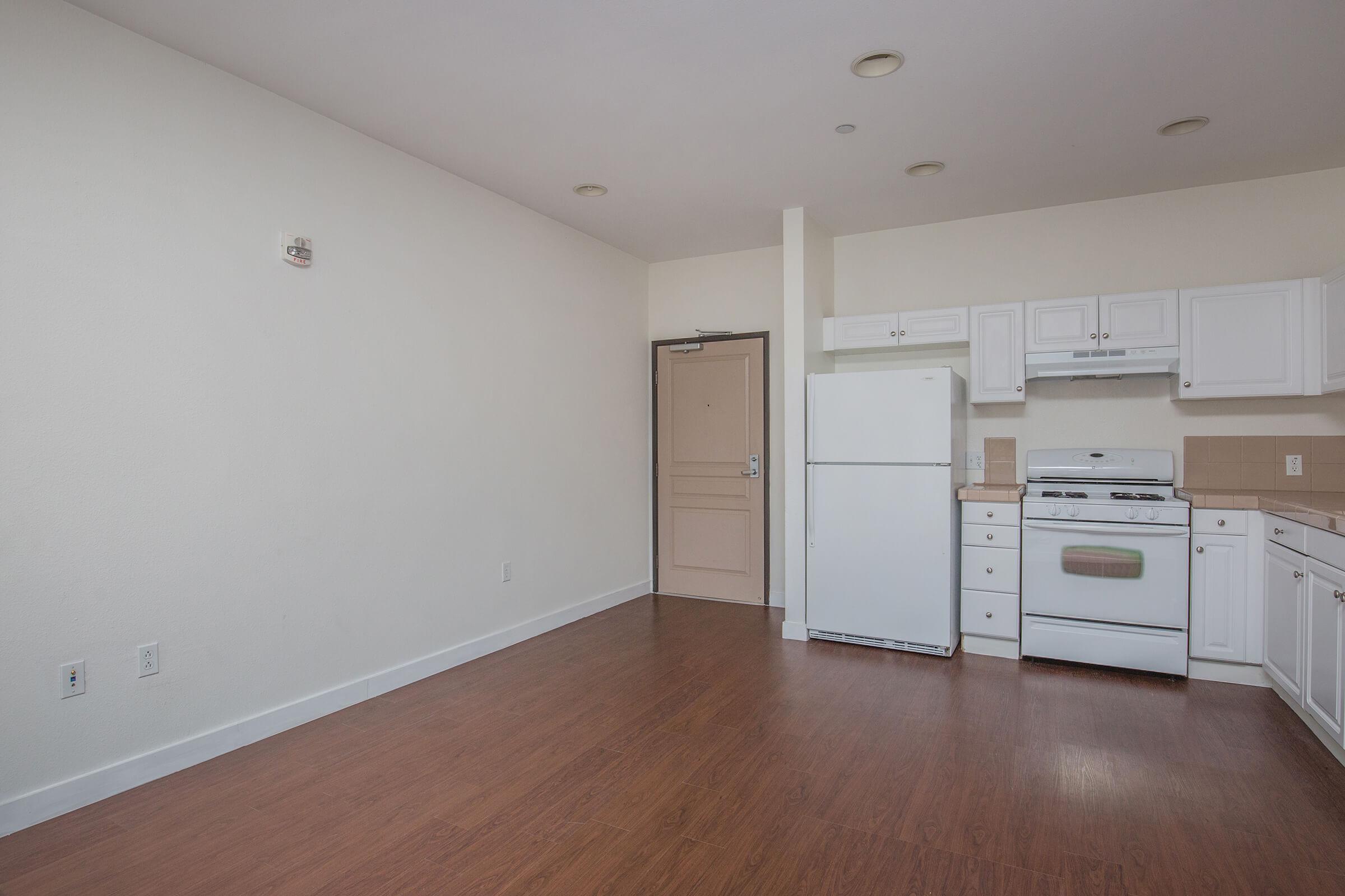 a large white refrigerator in a kitchen