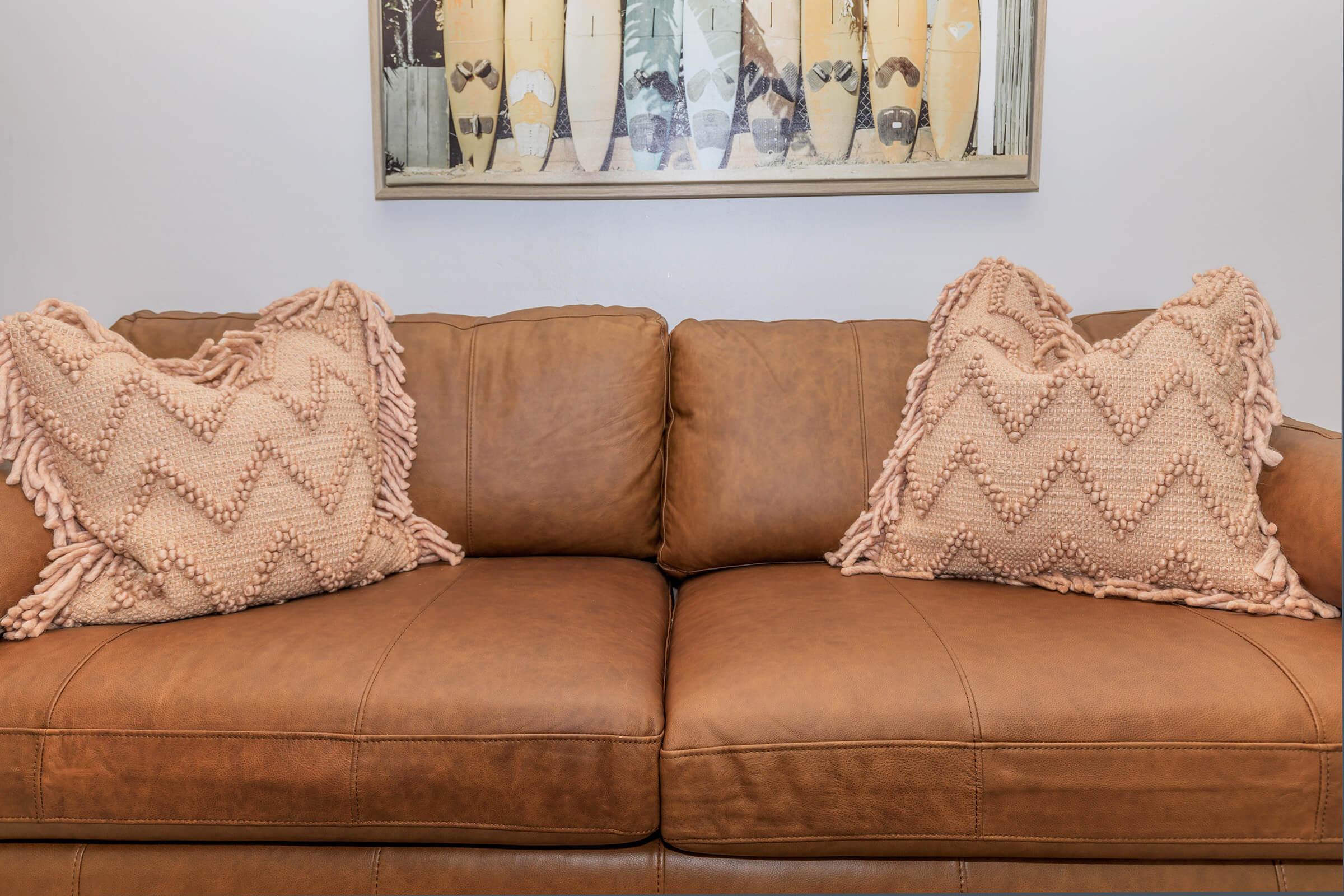 a brown leather couch in a living room