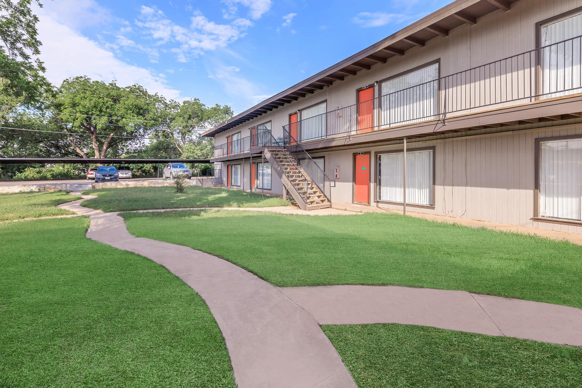 a large lawn in front of a building