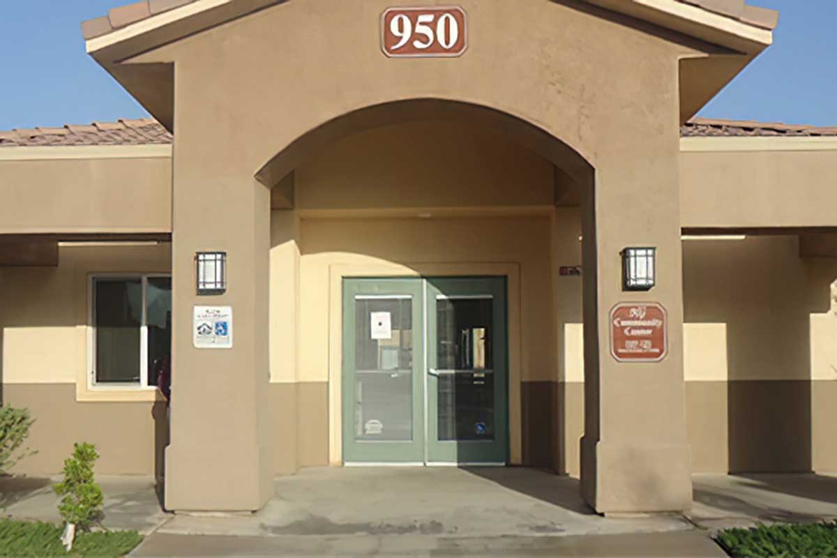 ront view of a building with the number 950 displayed above the entrance.