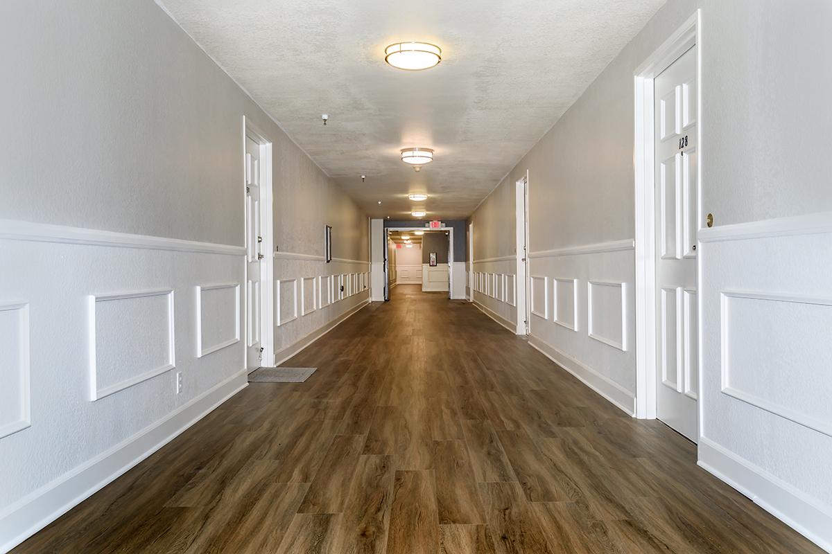 Heritage Pointe Senior Apartments hallway with wooden floors