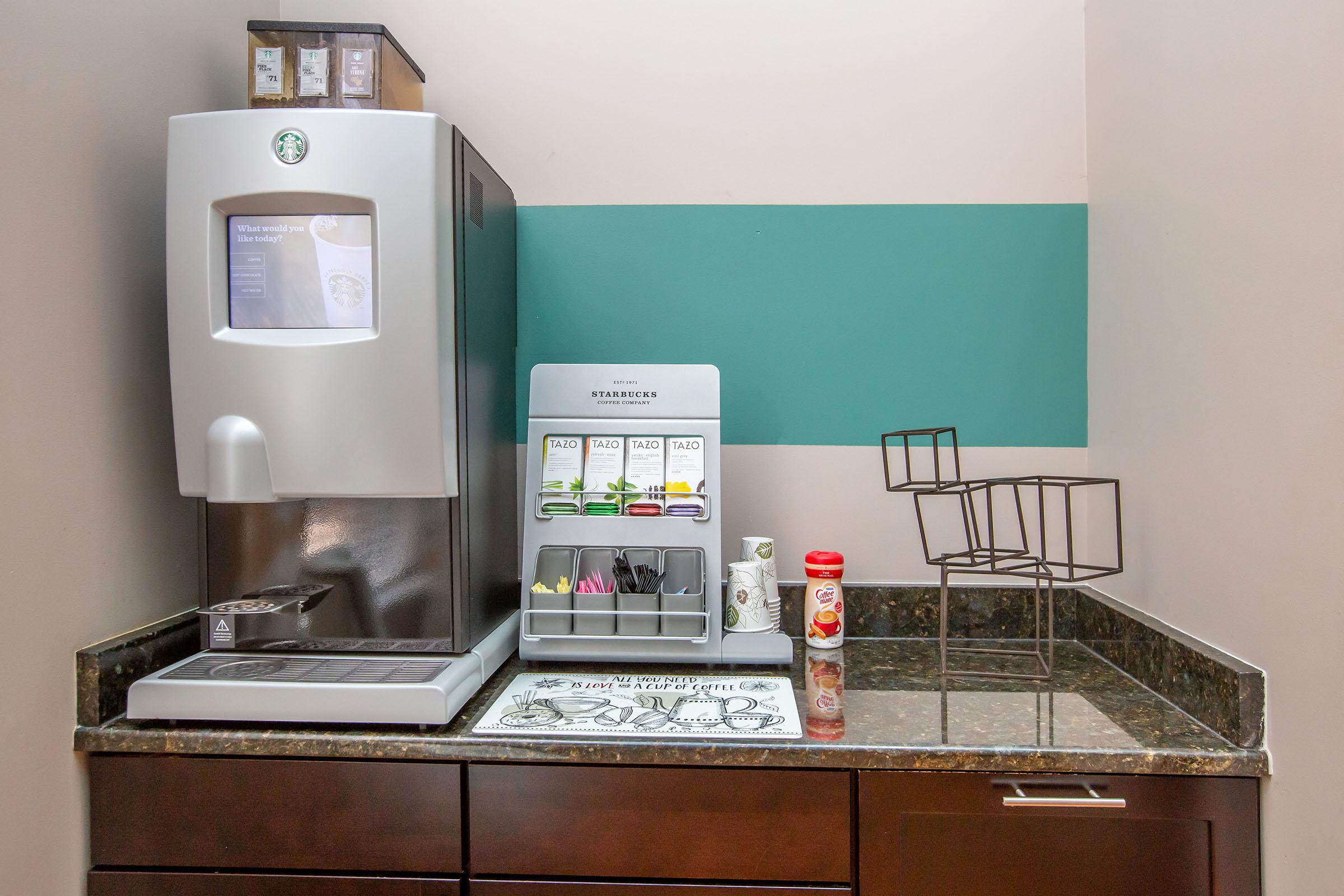 a kitchen with a sink and a microwave