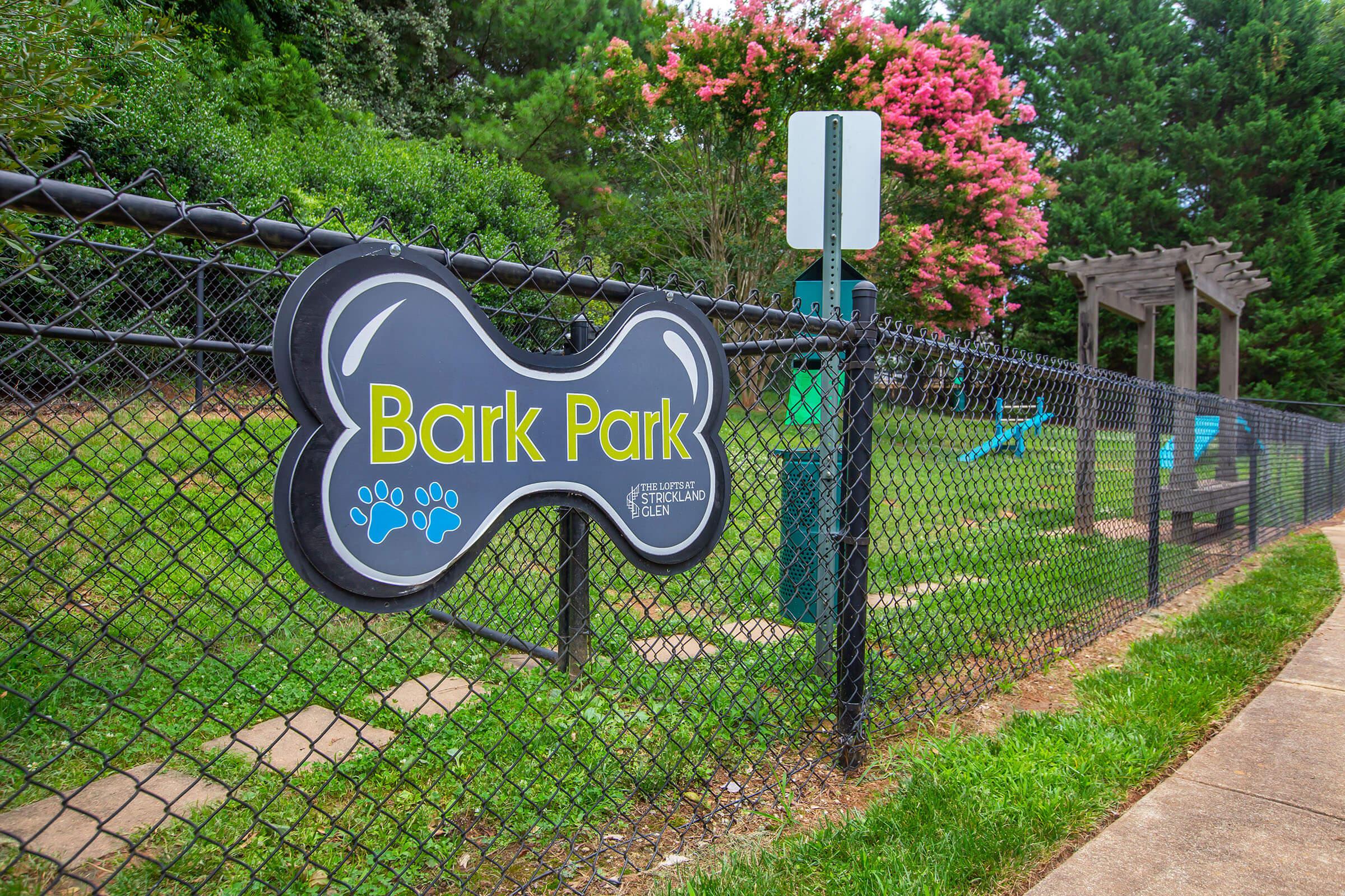 a sign on the side of a fence