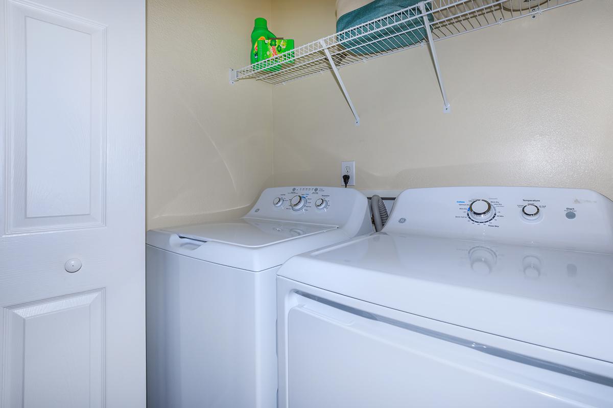 a white refrigerator freezer sitting next to a sink