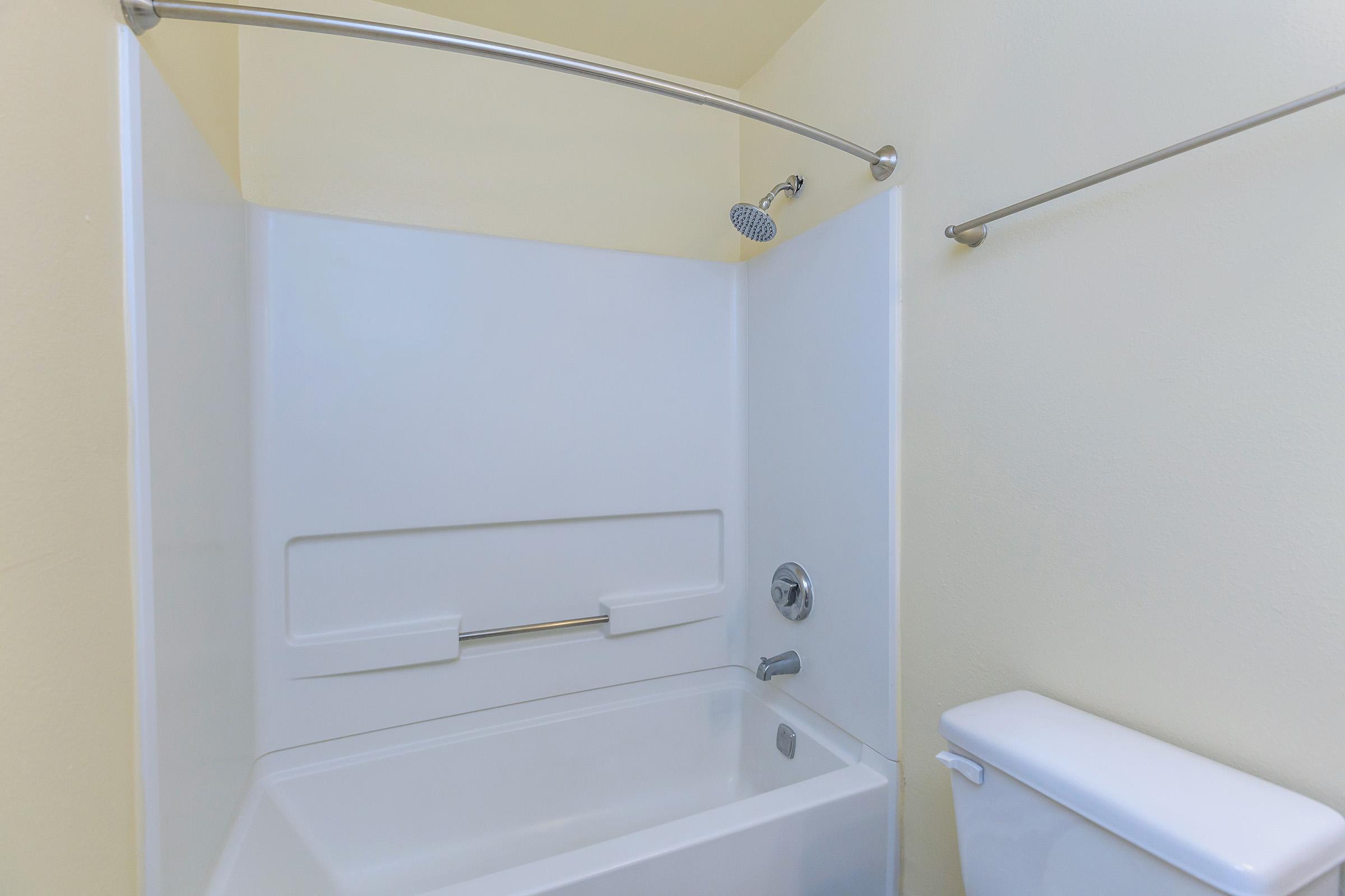 a shower that has a sink and a mirror