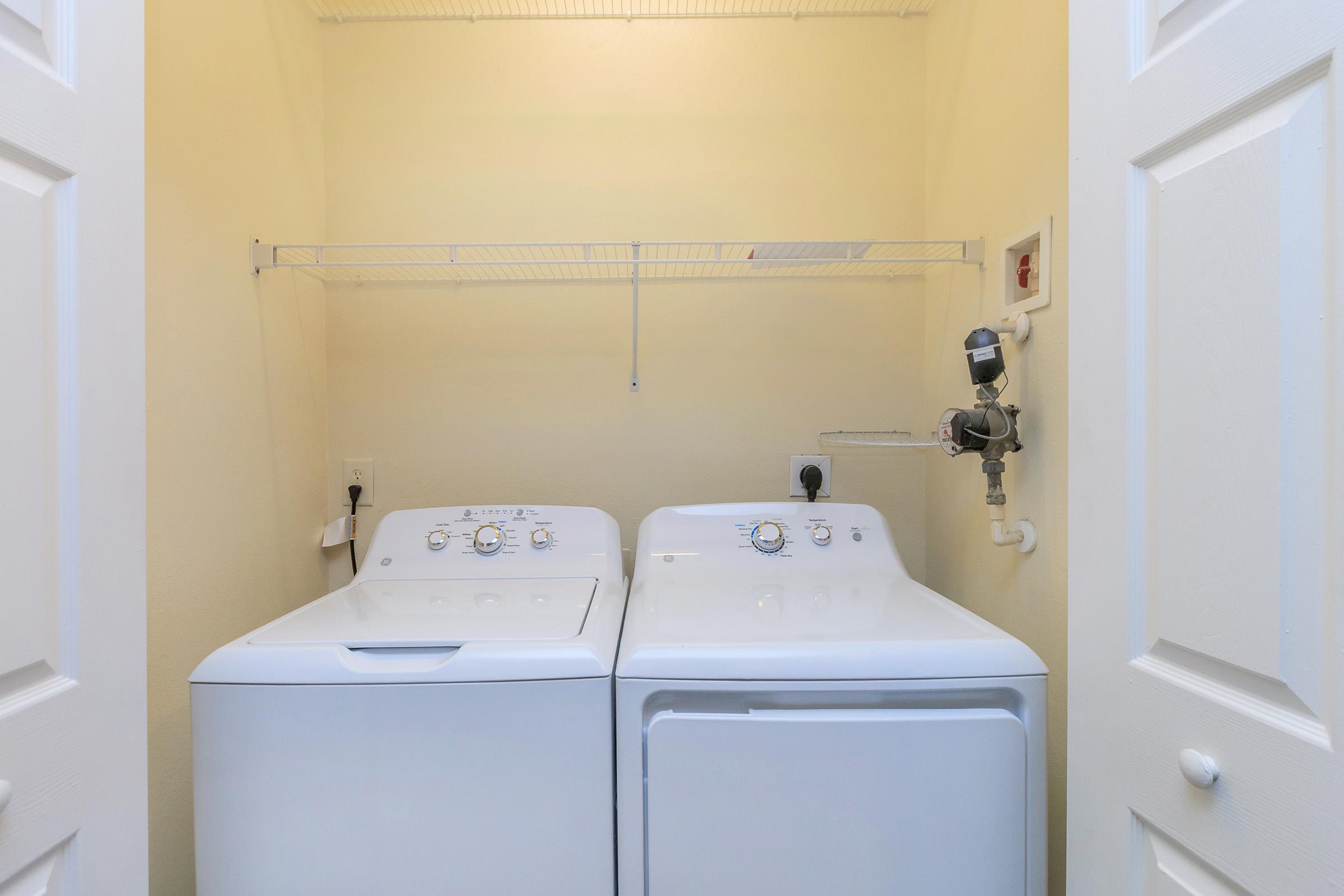 a kitchen with a sink and a mirror