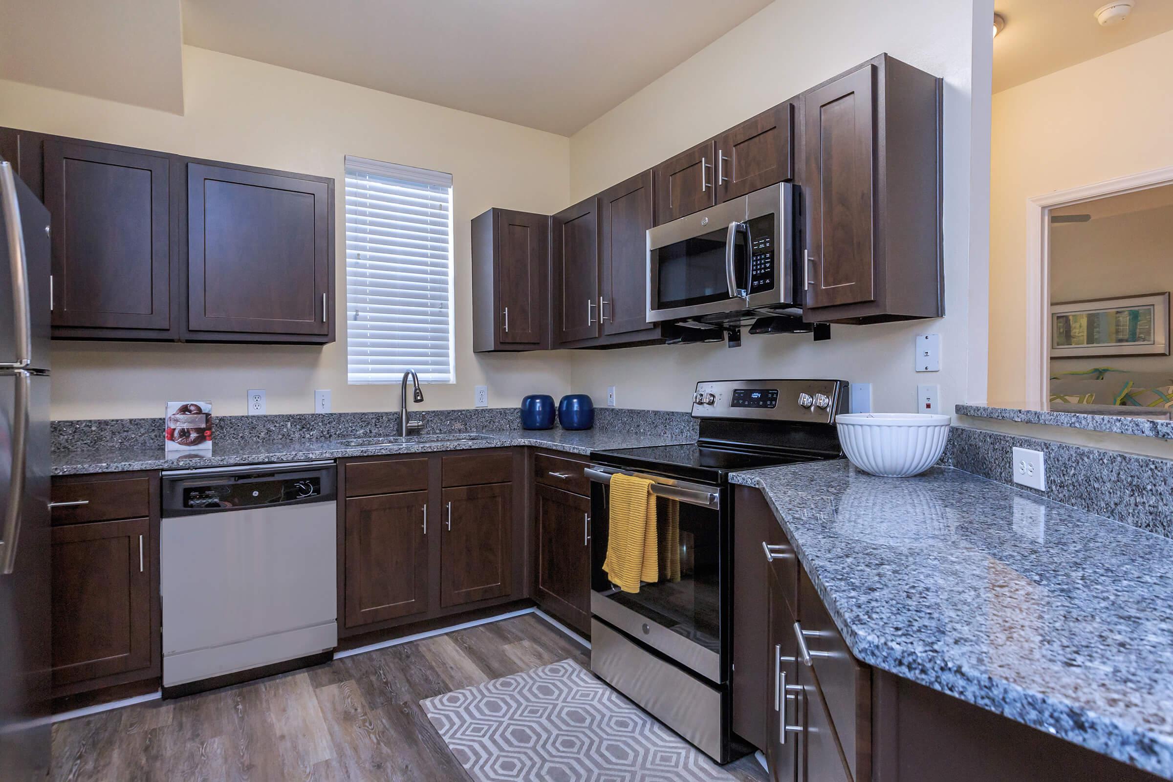 a modern kitchen with stainless steel appliances