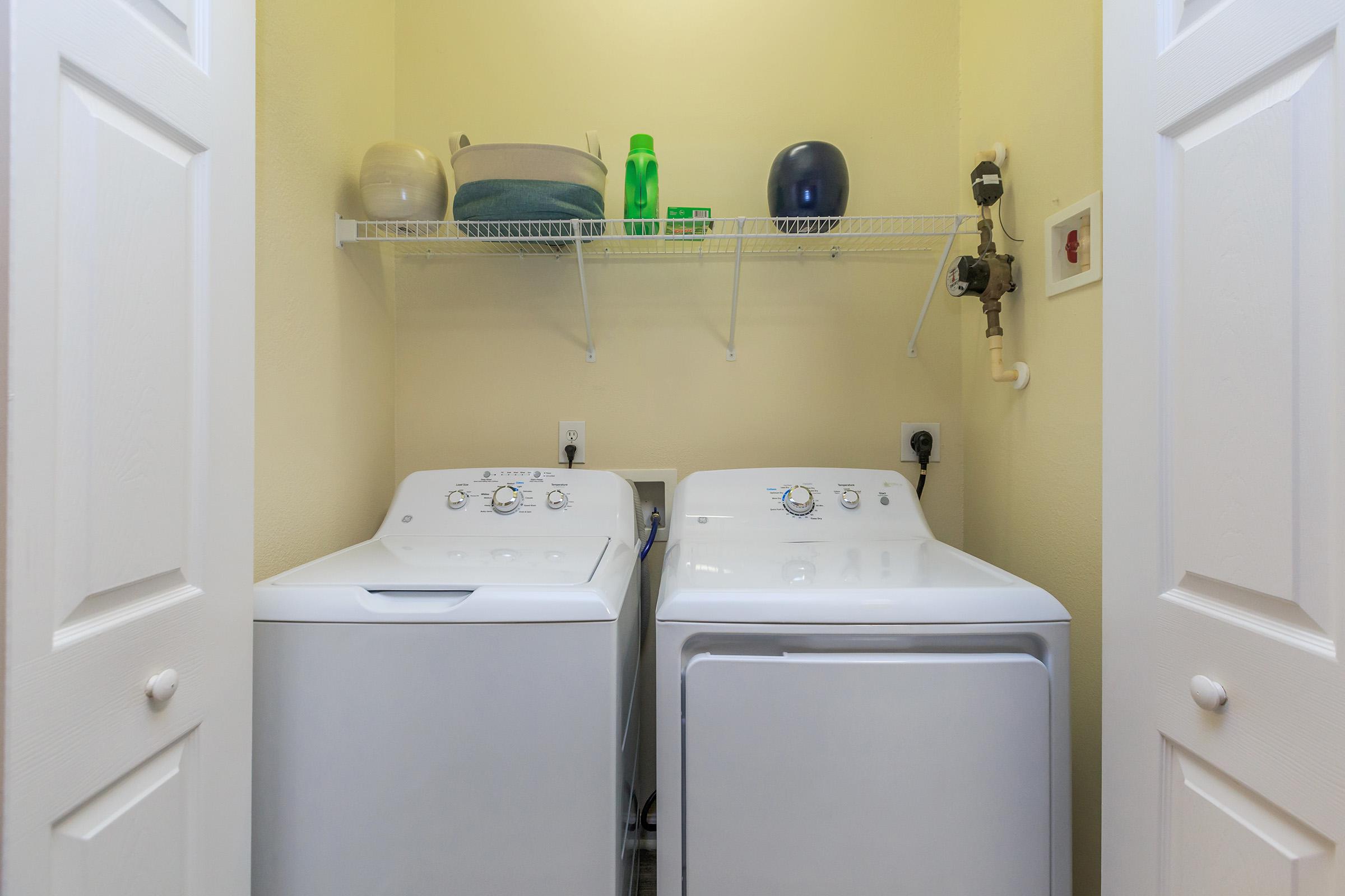 a kitchen with a sink and a refrigerator