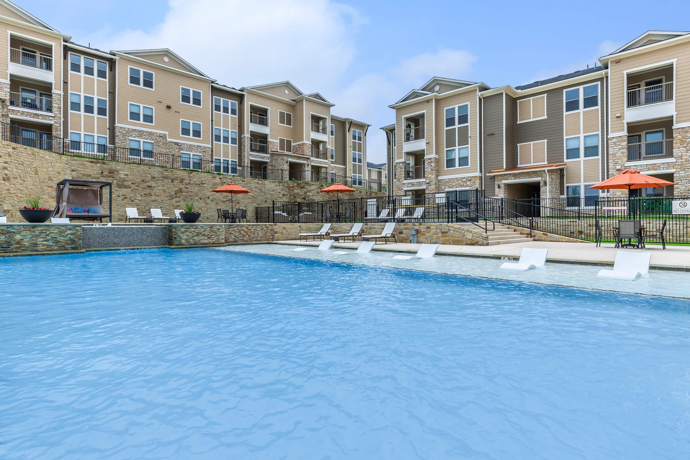 a large pool of water in front of a building