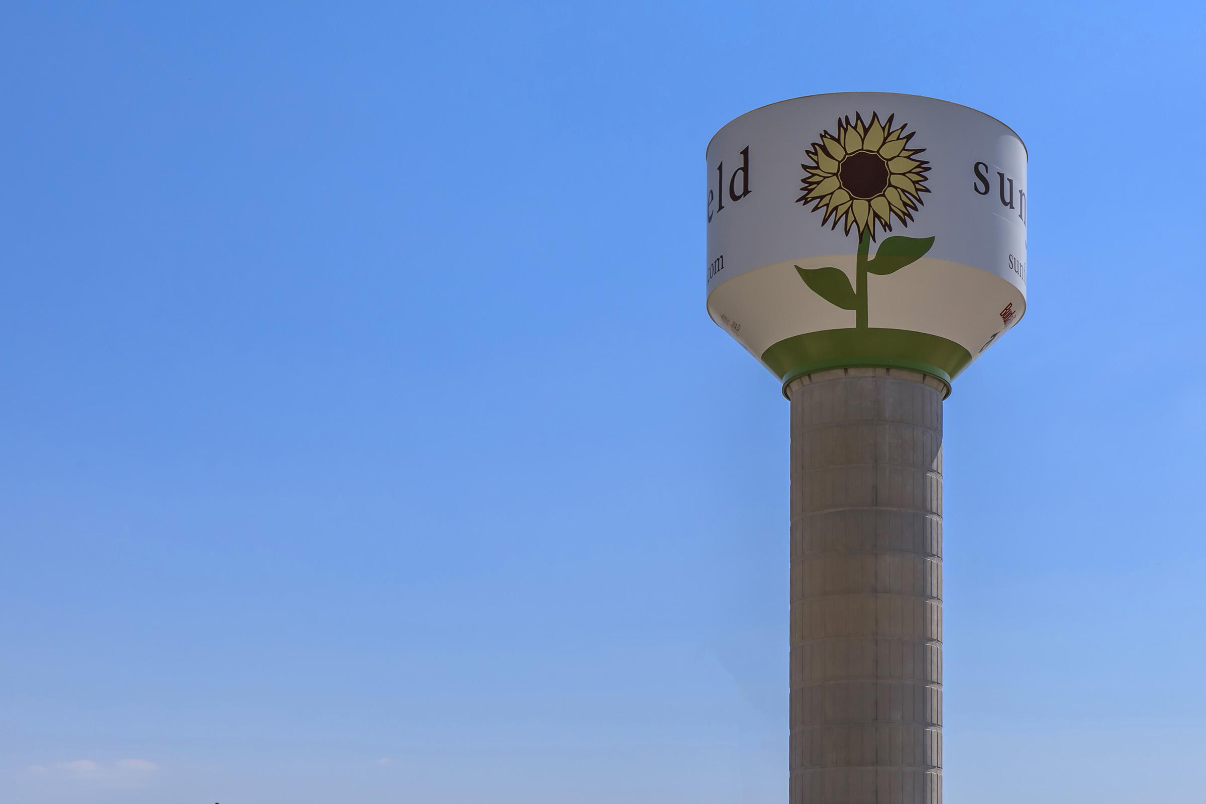 a tall clock tower sitting under a blue sky