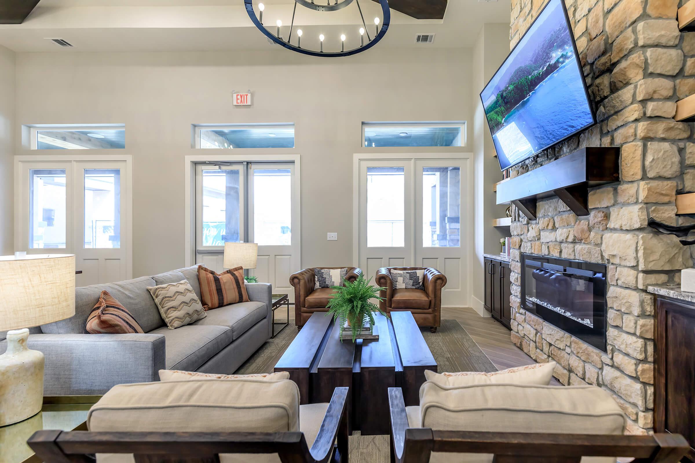 a living room filled with furniture and a large window