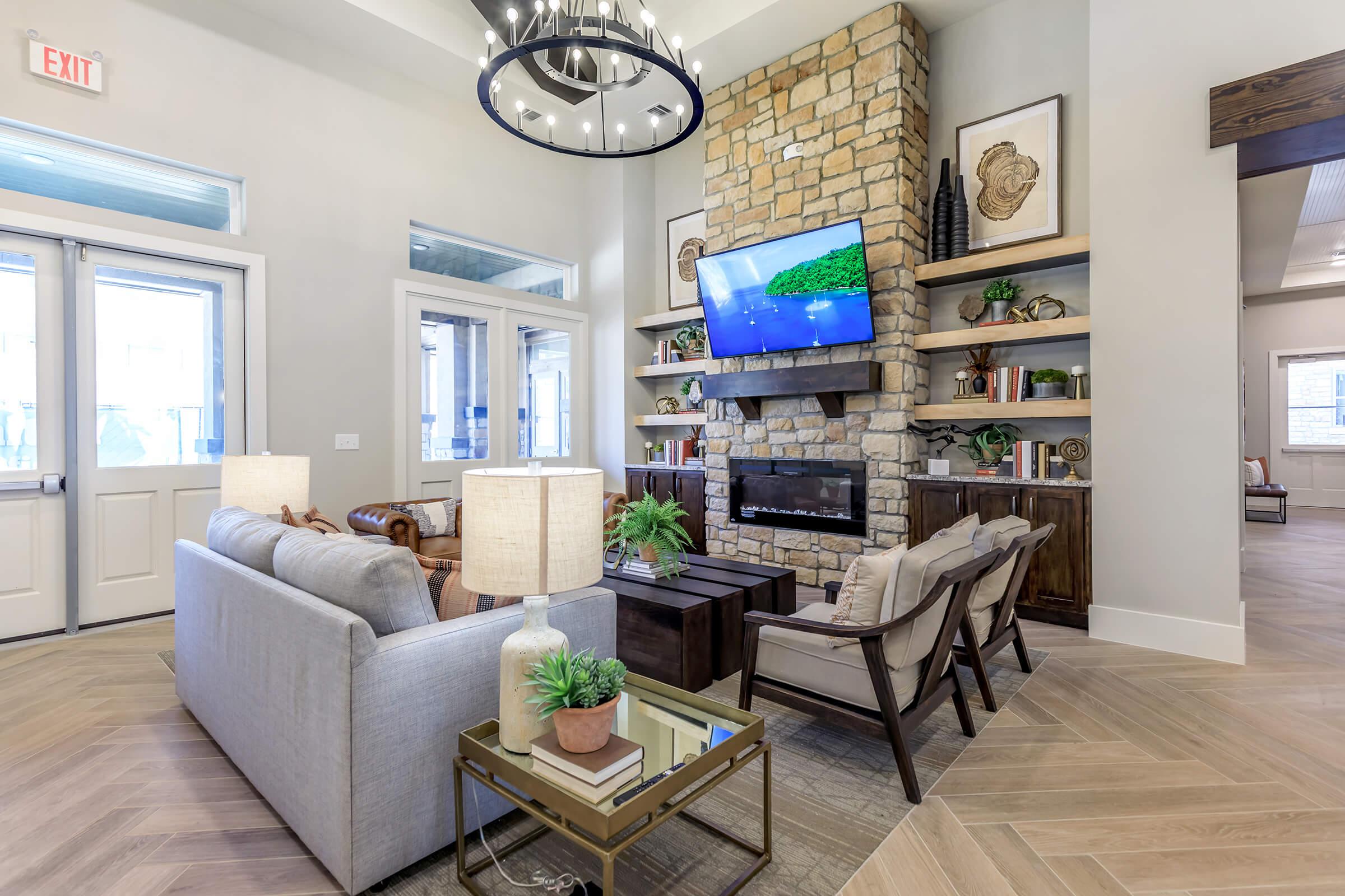 a living room filled with furniture and a large window