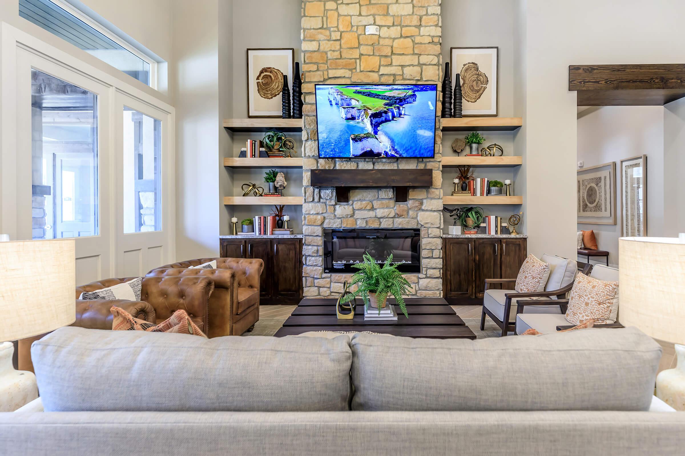 a living room filled with furniture and a fireplace